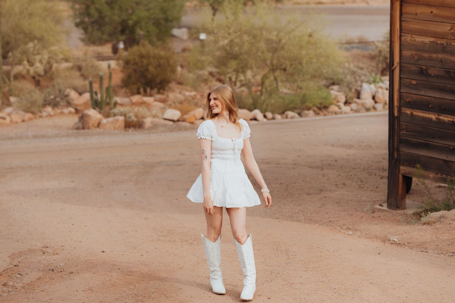 western style photoshoot, arizona, goldfield ghost town. white dress cowboy boots photos