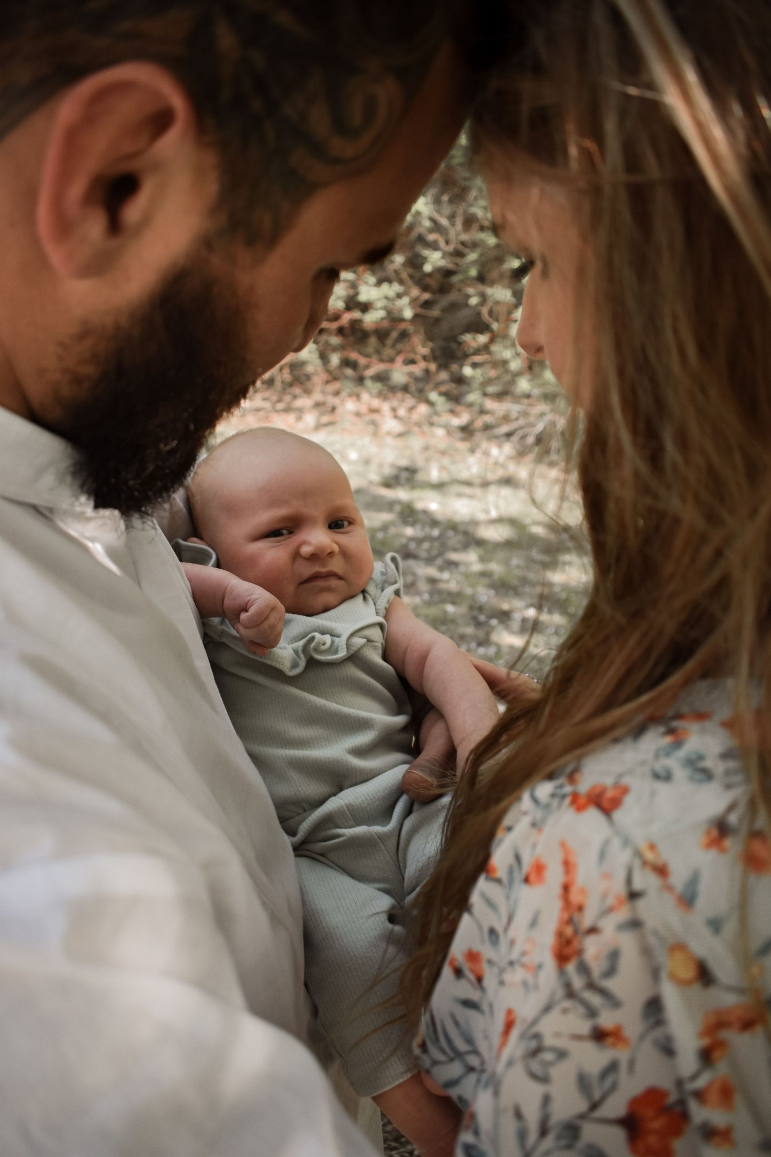 Baby photoshoot. 3month old poses and mom and dad holding baby