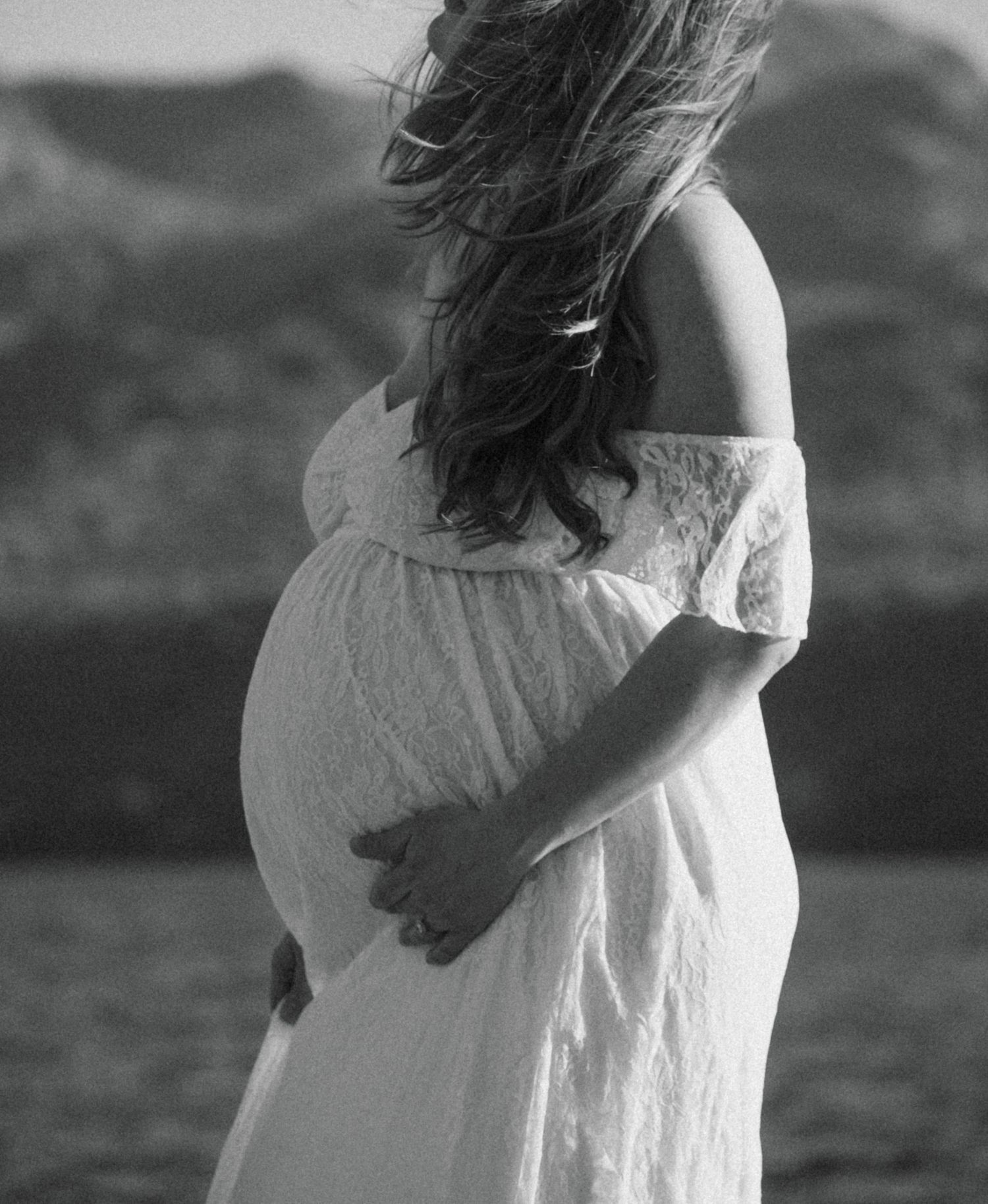 pregnancy maternity shoot. Arizona photoshoot with lake and sunset. white crown and white dress
