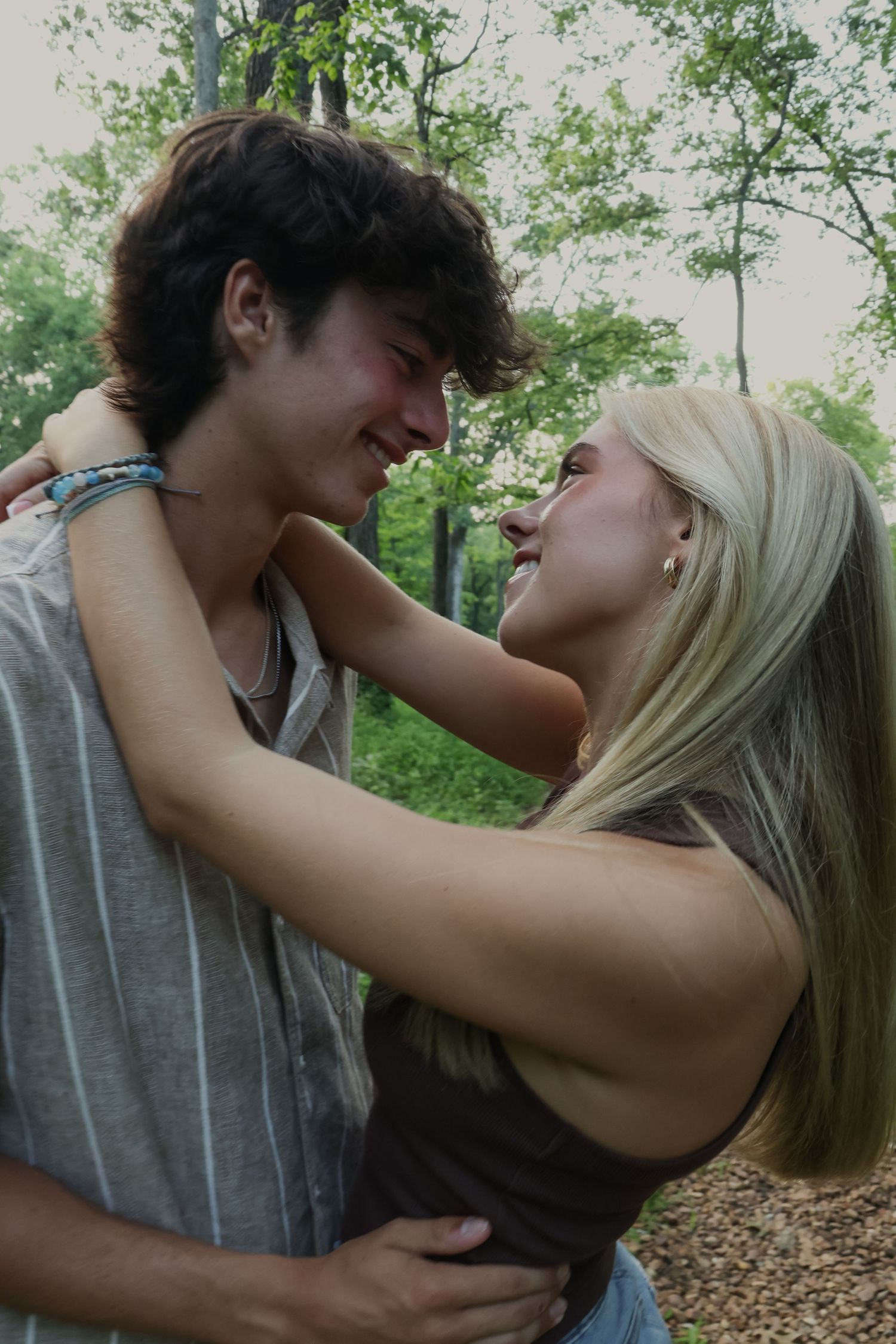 Digital photograph of a couple holding each other and smiling.