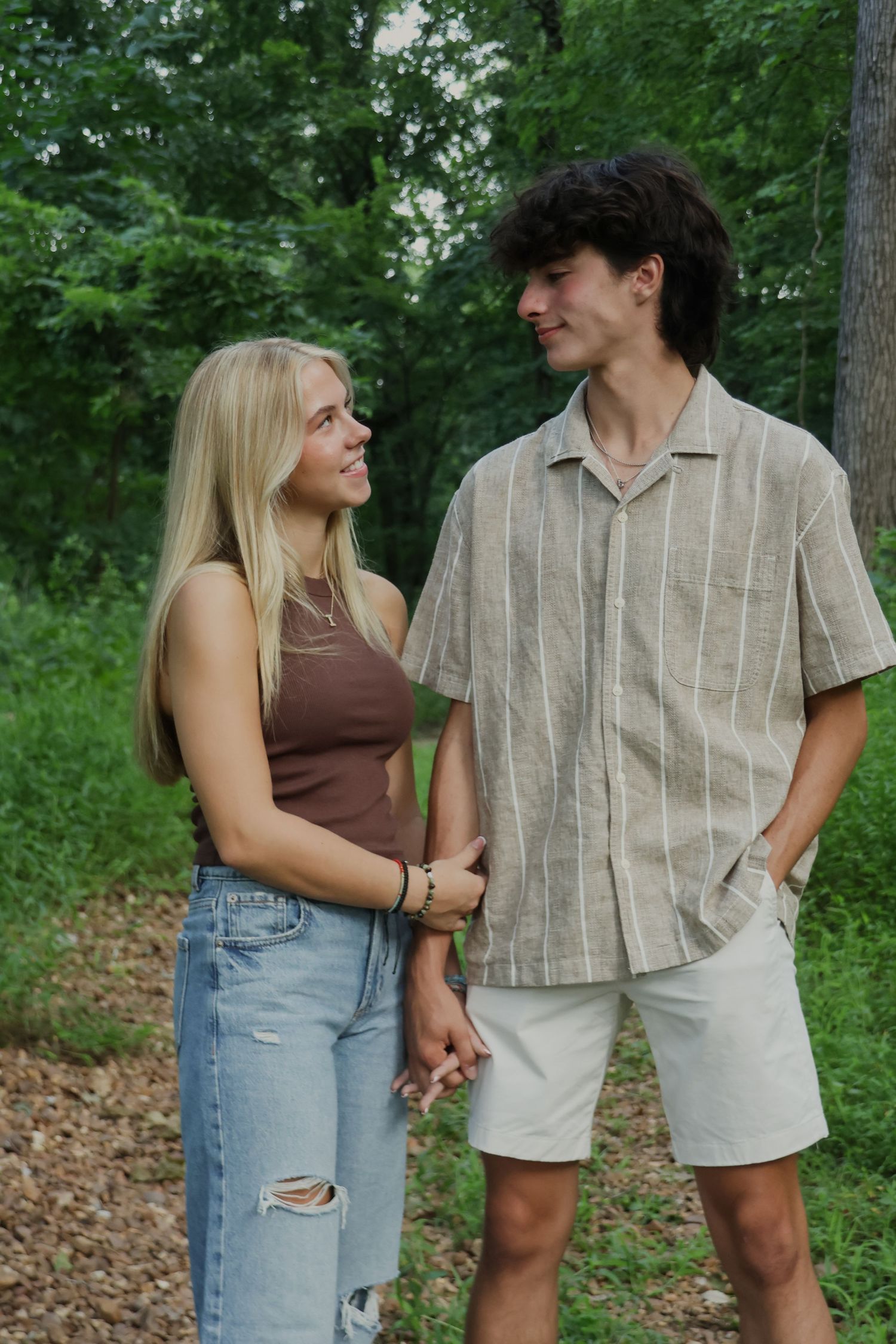 Digital photograph of a couple holding hands and smiling.
