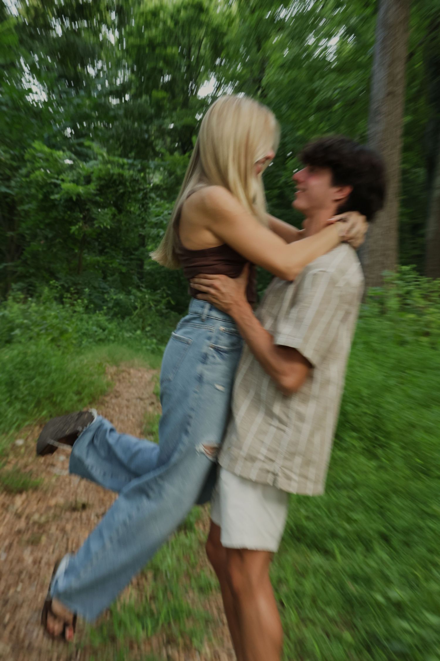 Digital photograph of a couple smiling and holding each other.