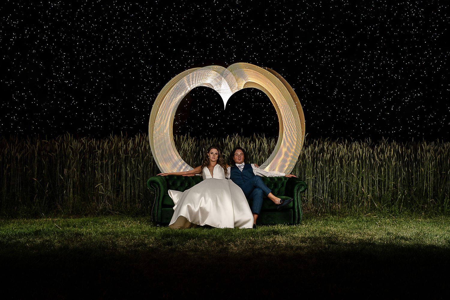 Bride and groom sit on couch at Storm King mountain ranch. Captured by Montrose Colorado Photographers
