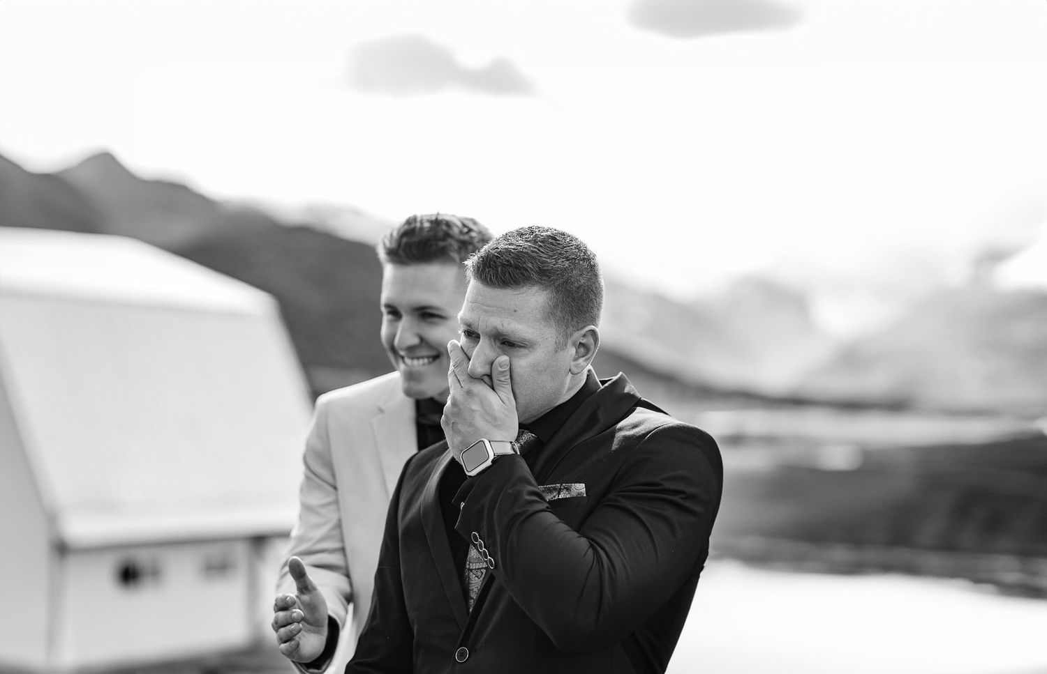 Groom holds breath and lets out tears while seeing his bride for the first look. Captured by Ridgway, Colorado Photographers