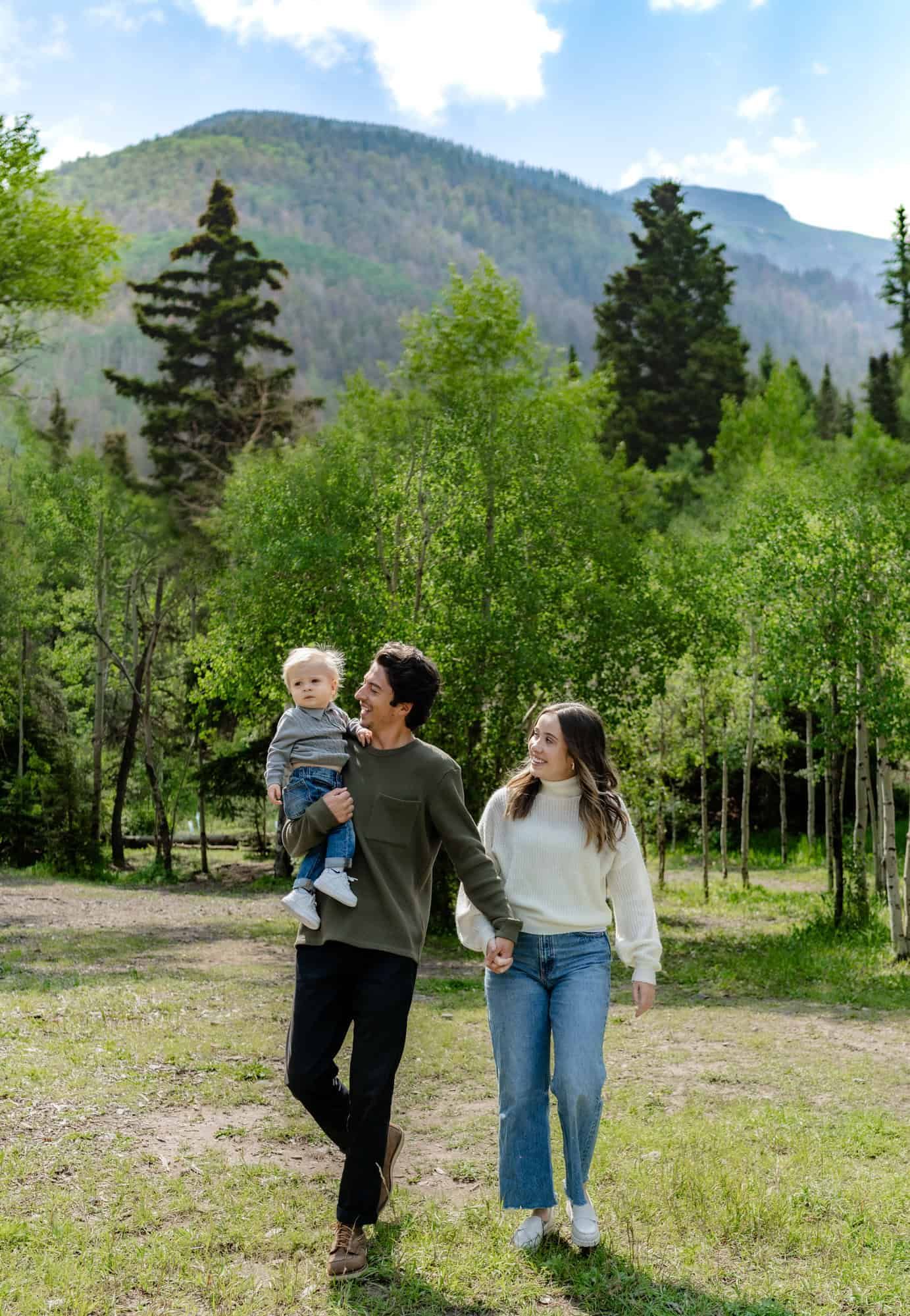 Mountain scenery with evergreen trees and a moment of togetherness in a beautiful natural setting.