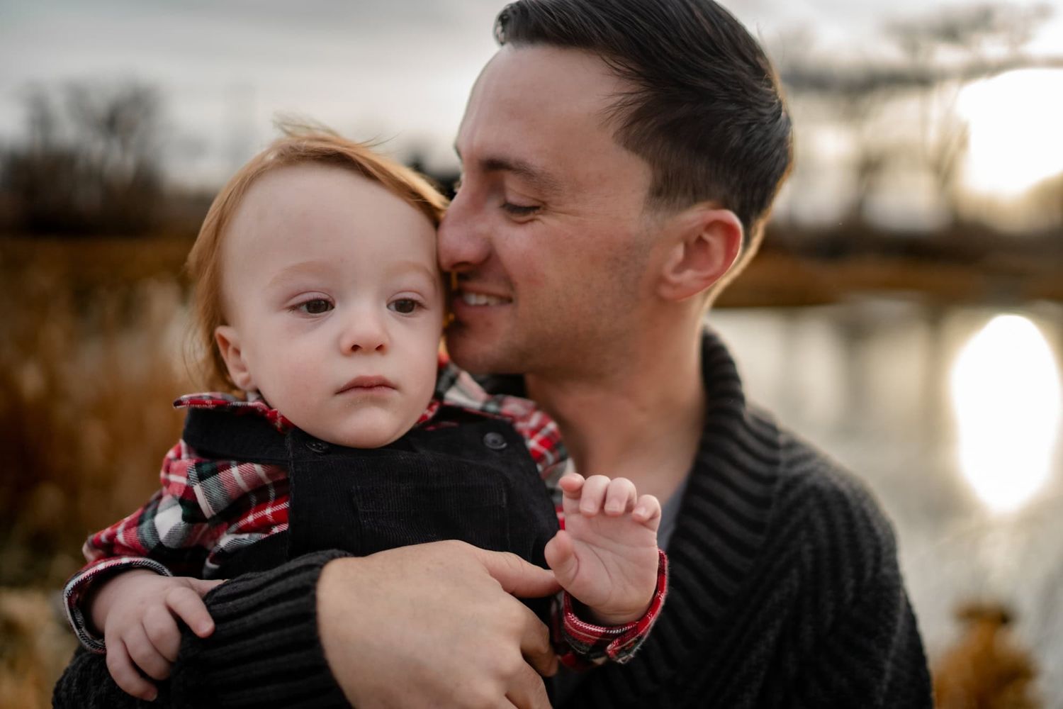A tender moment between parent and child in warm evening light.