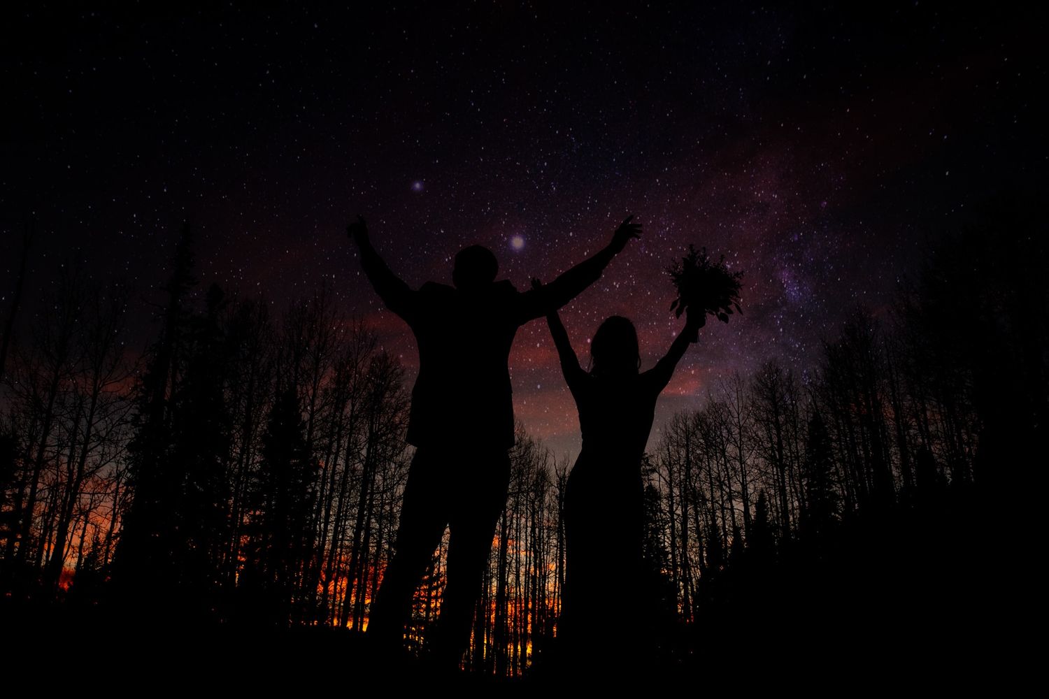 Couple celebrates elopement on Owl Creek Pass with starry sky. Captured by Ridgway Colorado elopement photographers