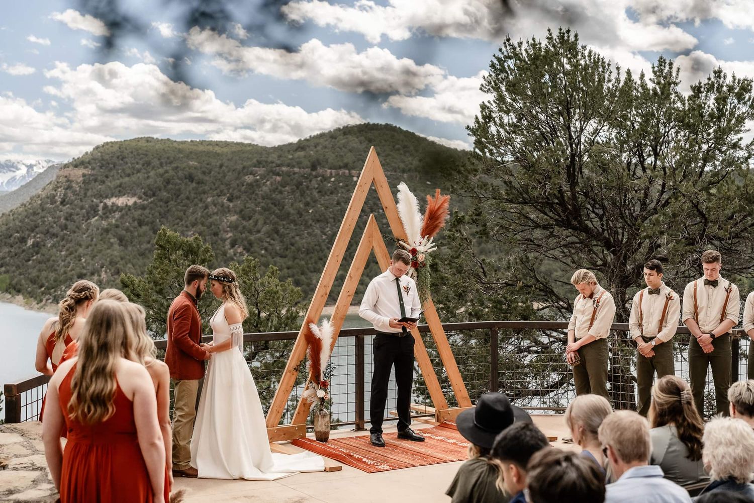 A scenic mountain Christian wedding ceremony takes place at Ridgway State Park. captured by Montrose Colorado Photographers