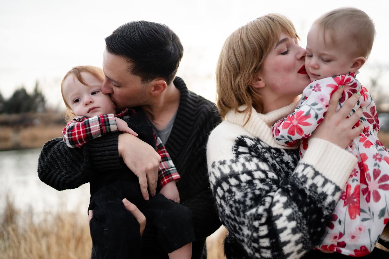 Parents share tender moments with their babies while wearing cozy winter sweaters.