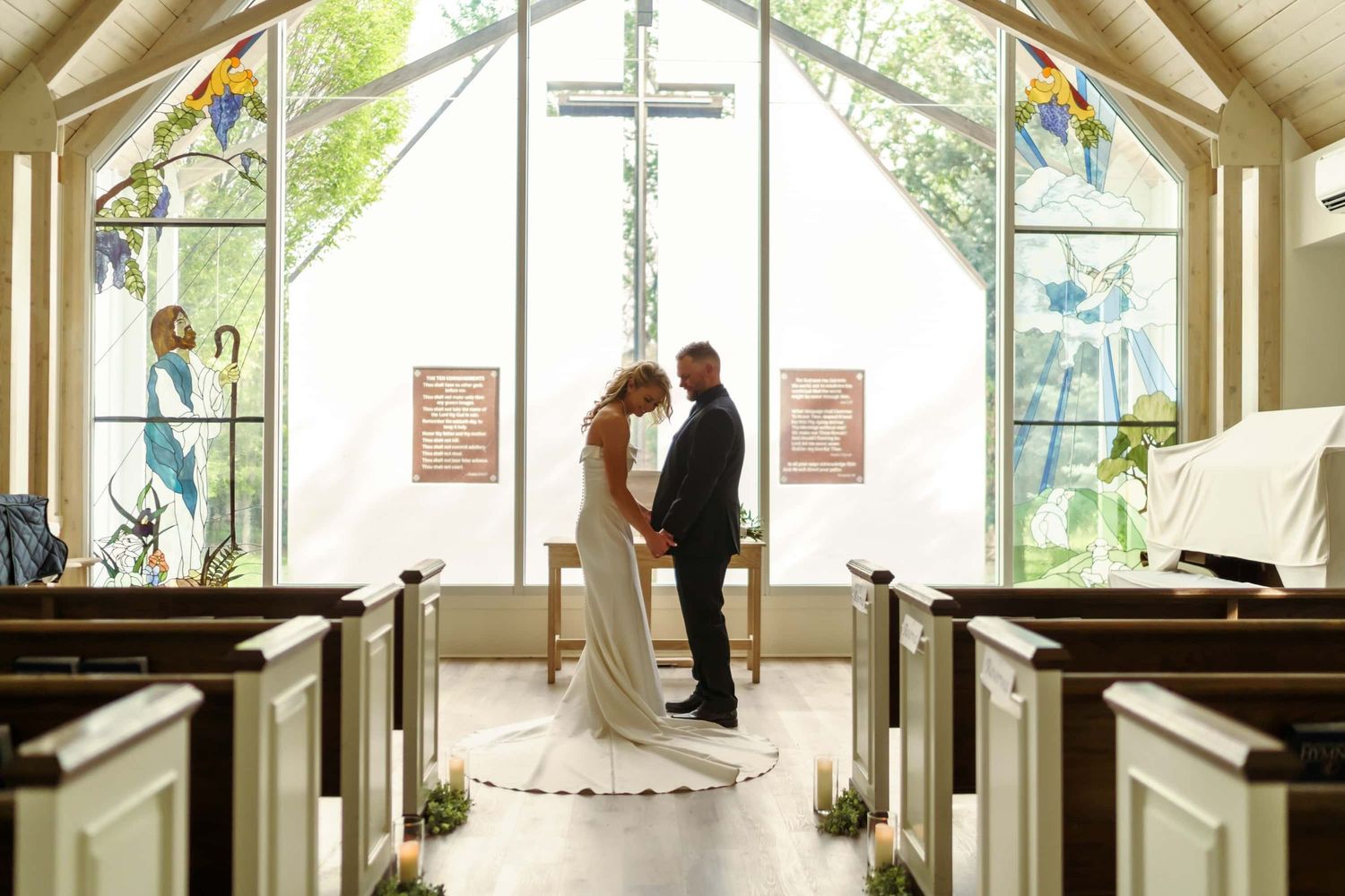 Chapel of the Cross in Cedaredge Colorado with newly wed couple. Photo by Christian Colorado wedding photographer in Pioneer Town.