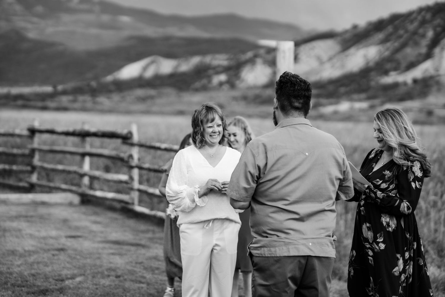 Black and white candid moment of bride with mountain landscape. Mountain view wedding venue near Montrose Colorado.