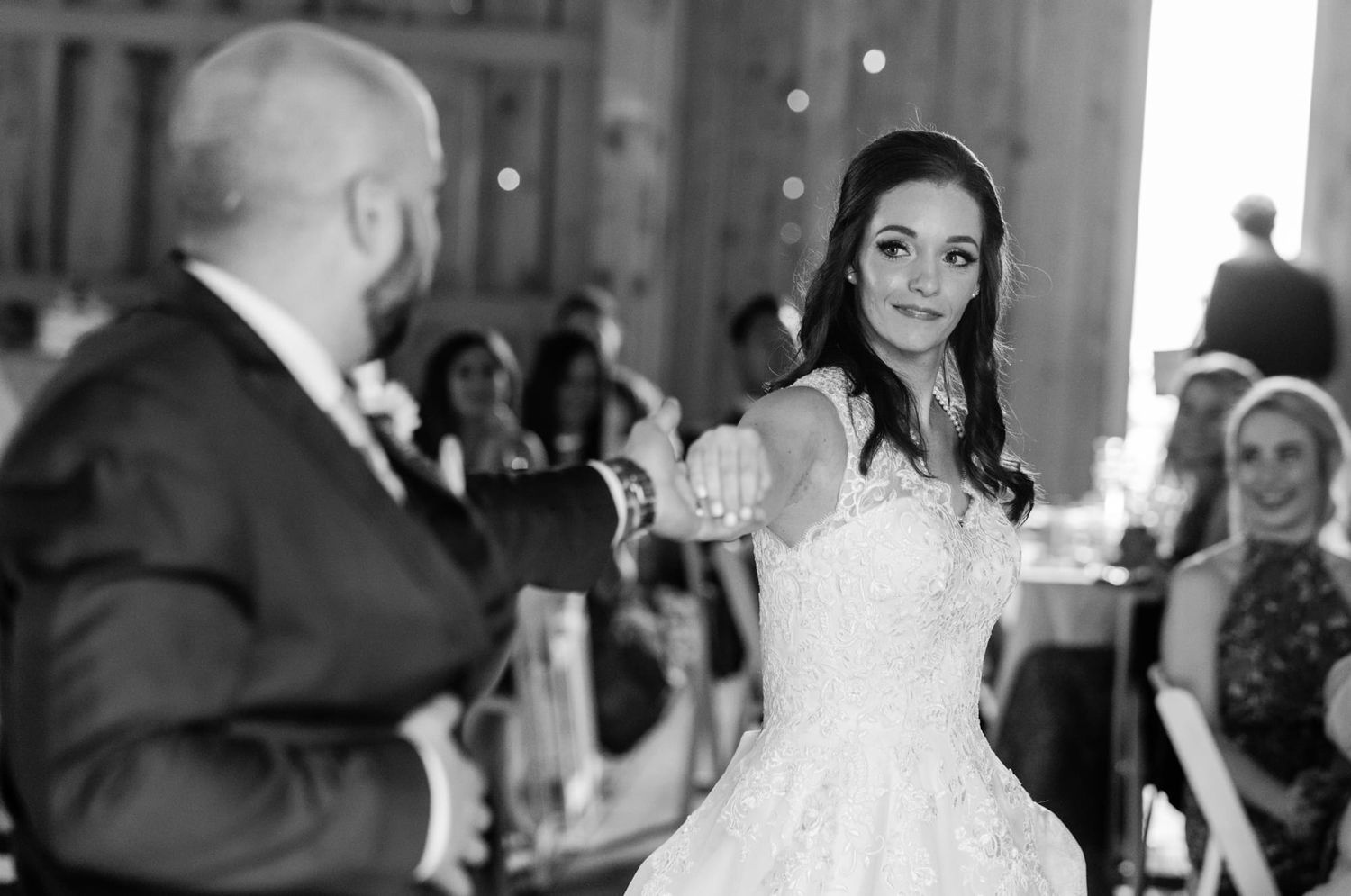 A dance moment captured during a wedding reception in an elegant venue.