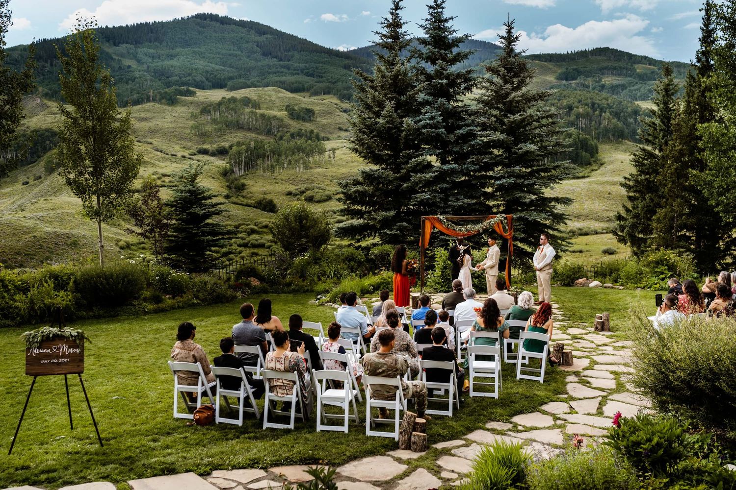 Wedding ceremony at one of many small wedding venues in Colorado with mountain views.