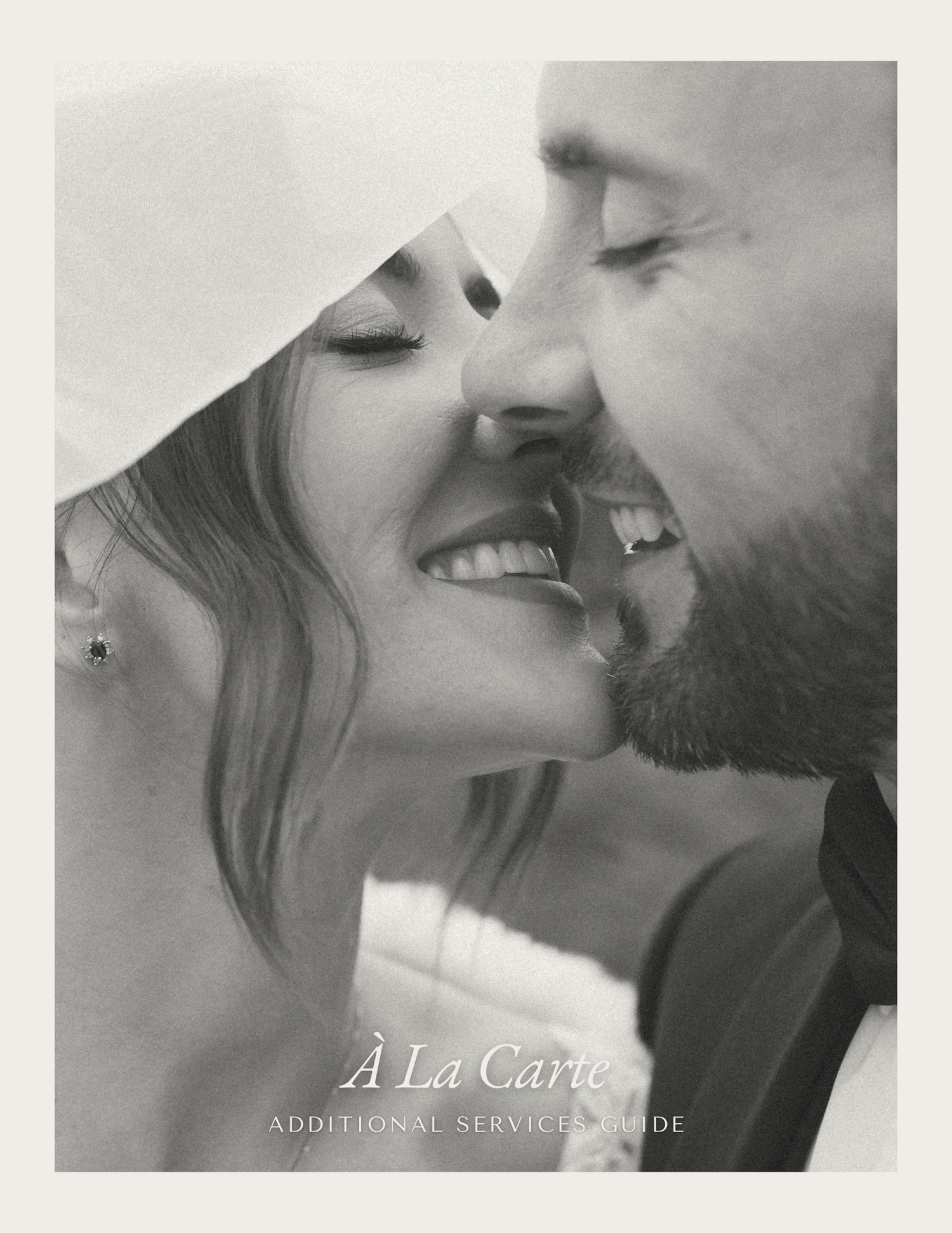 A romantic black and white close-up photo of a couple sharing an intimate kiss.