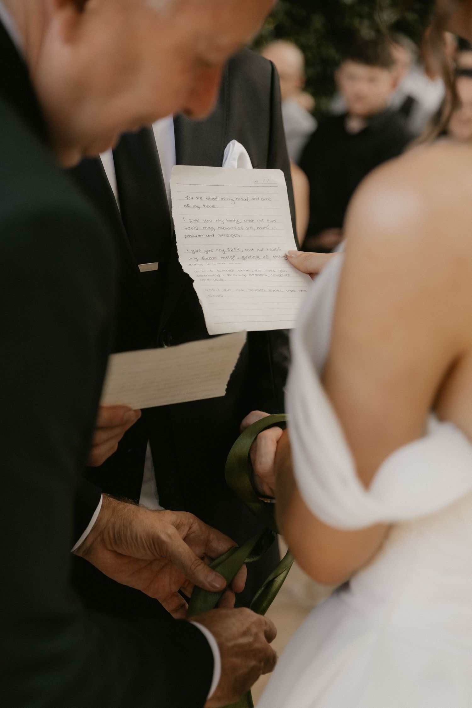 A series of wedding ceremony photos showing hands holding handwritten vows during an intimate exchange between newlyweds.