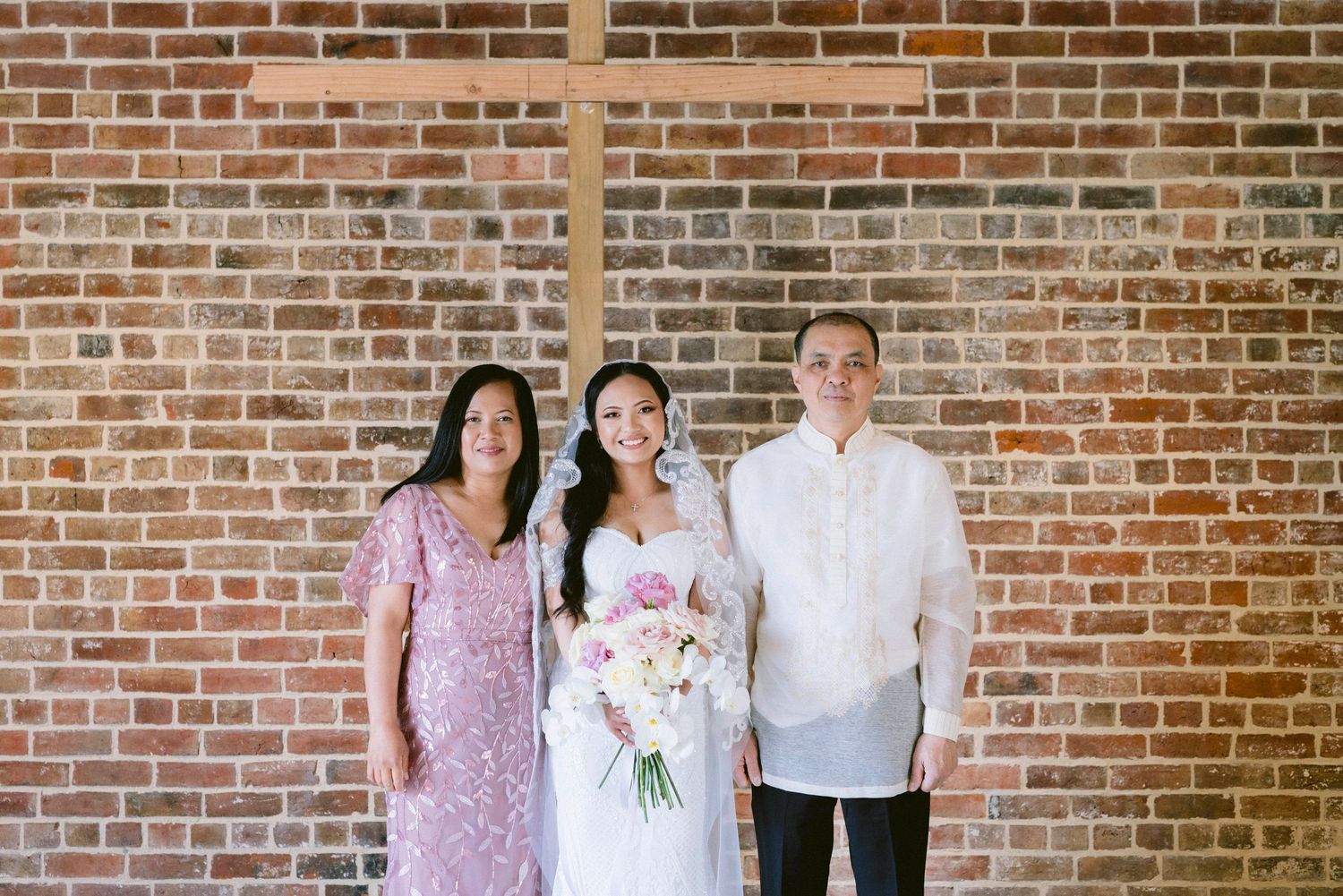 A row of candid moments captured against exposed brick walls during a wedding celebration.