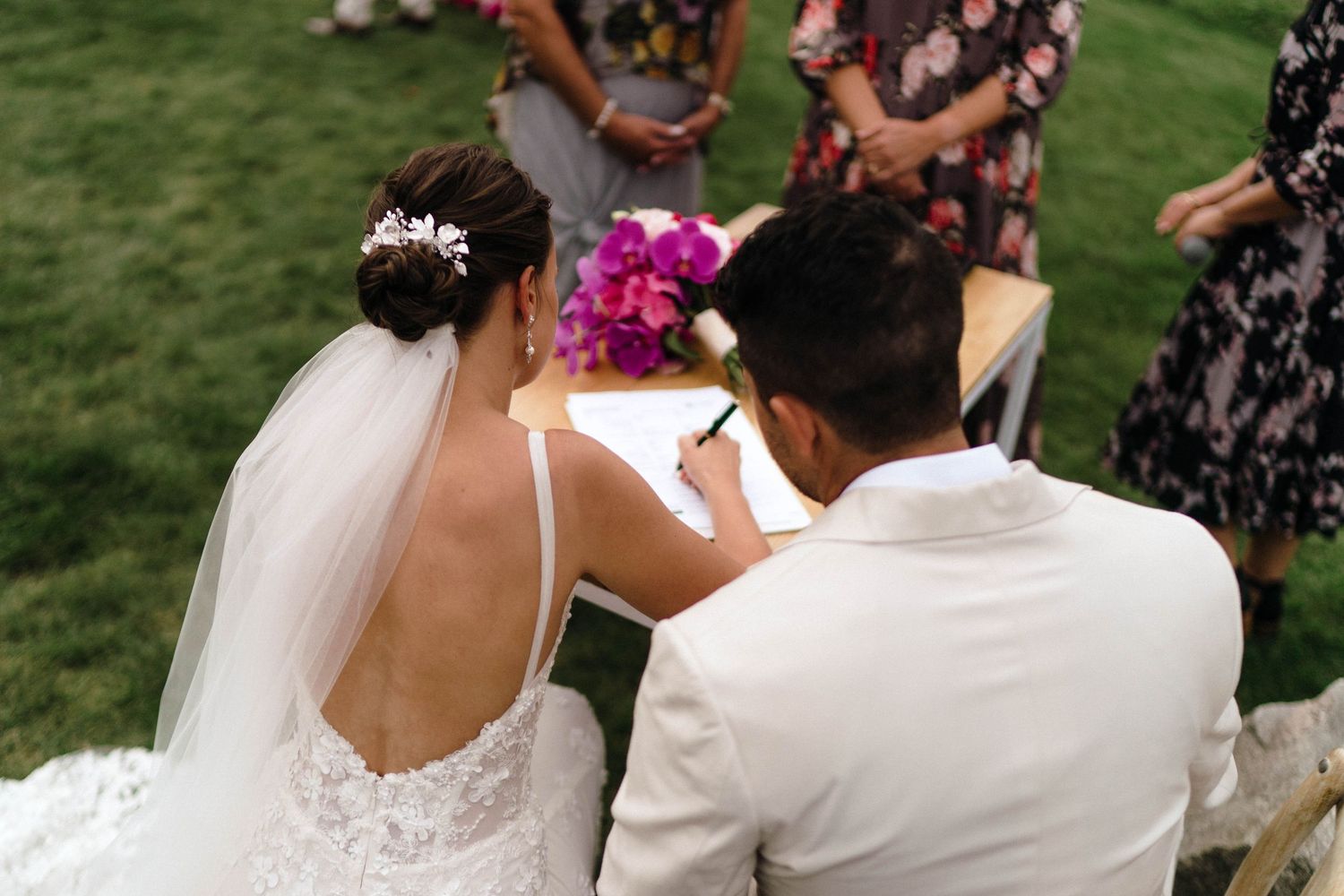 Wedding ceremony vows being exchanged in beautiful outdoor garden setting.