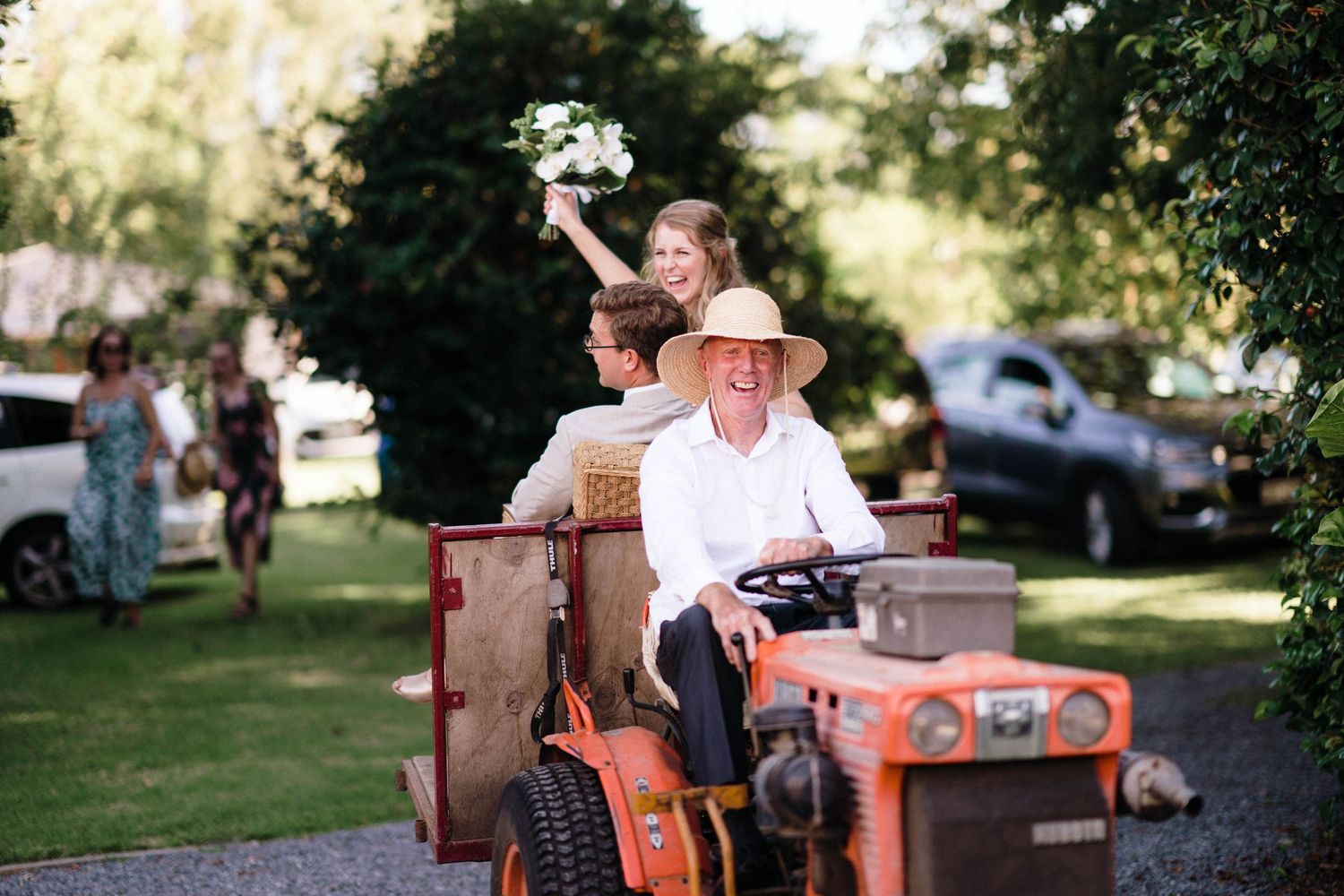 Six vintage film photographs showing a red Kubota tractor and farm scenes set in a rural summer setting.