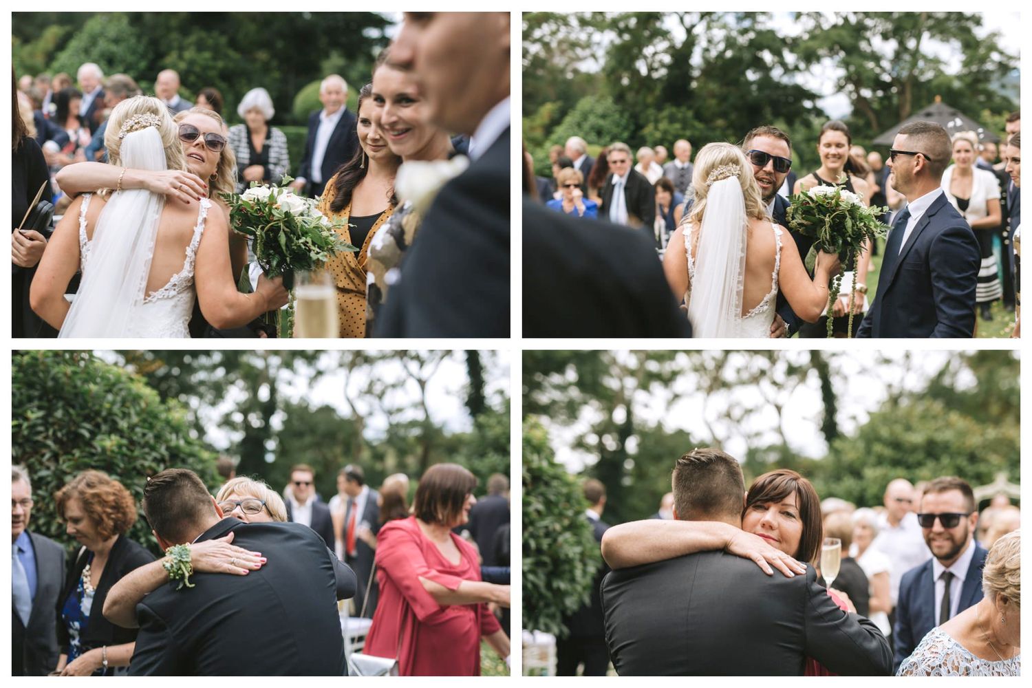 Joyful wedding guests gather outdoors for celebration photos in a natural garden setting.