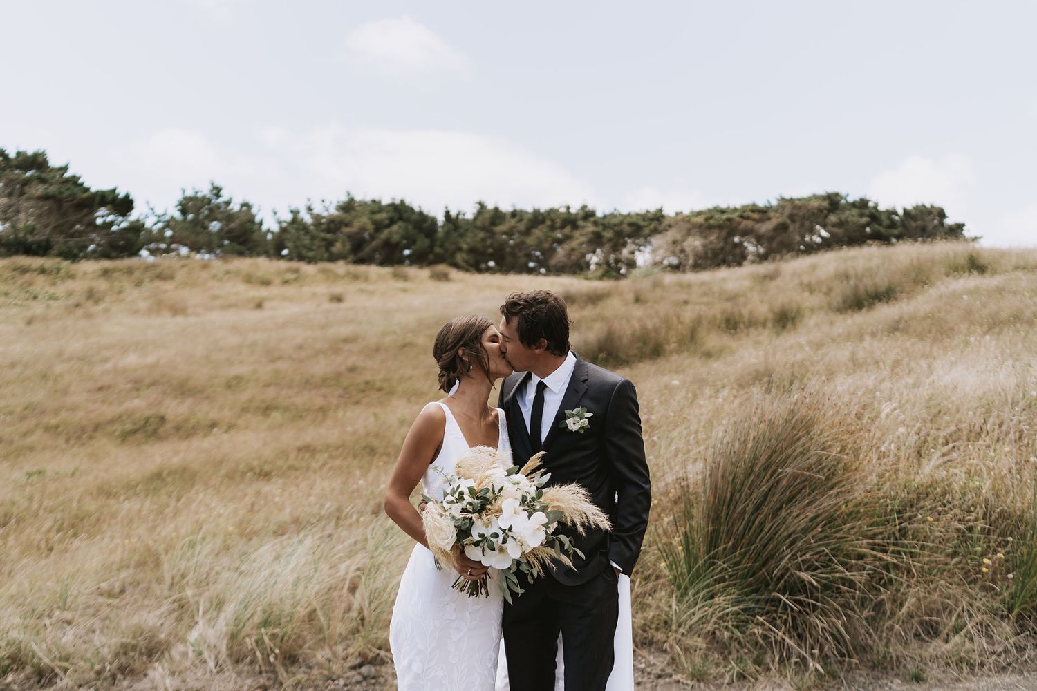 A collection of romantic wedding photos showing couples sharing intimate moments in a rustic outdoor setting with tall grasses.