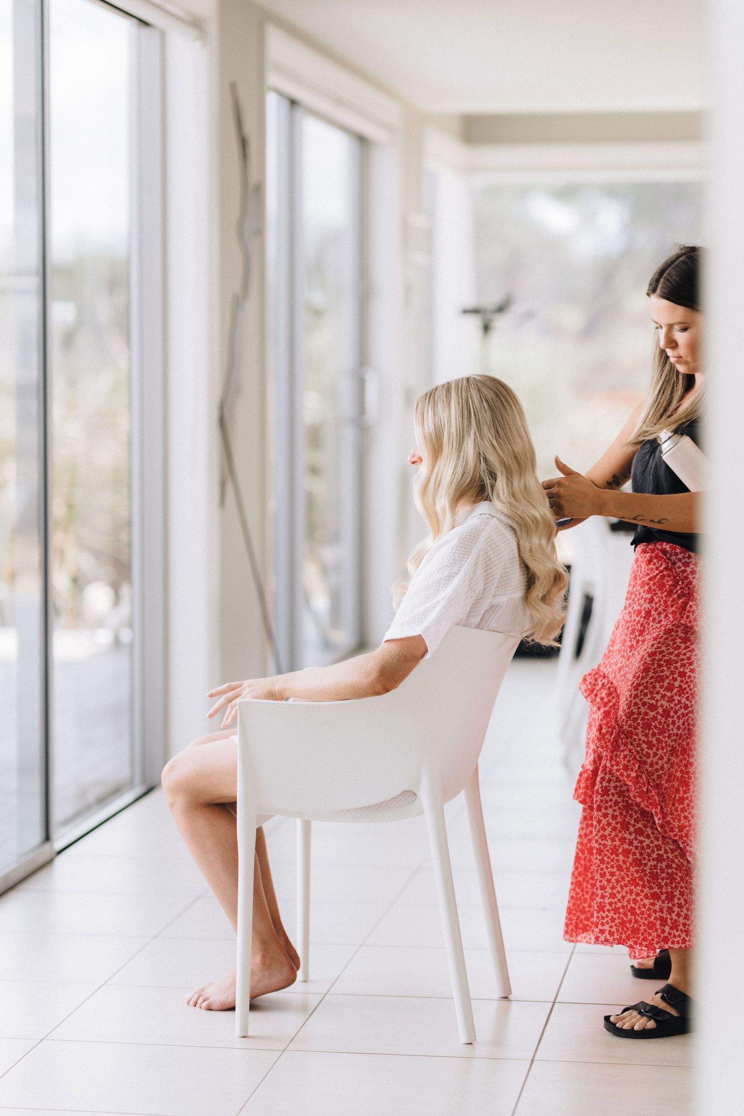 Three artistic dance poses in white studio showing graceful movement with natural light through windows.