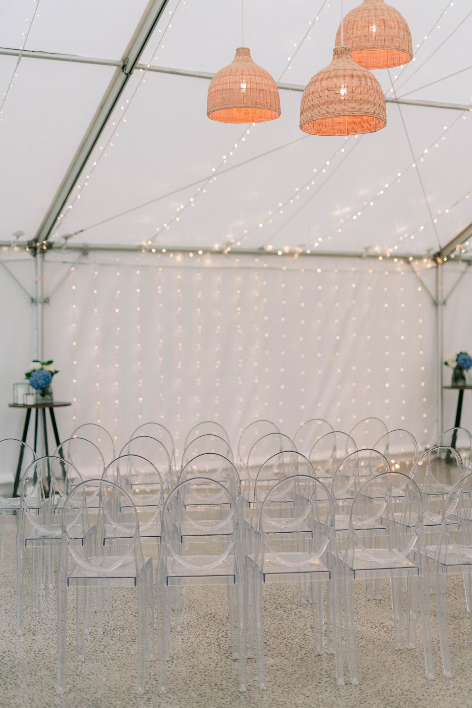 Three images showing an elegant event tent setup with silver chairs and coral pendant lights hanging from white draped ceiling.