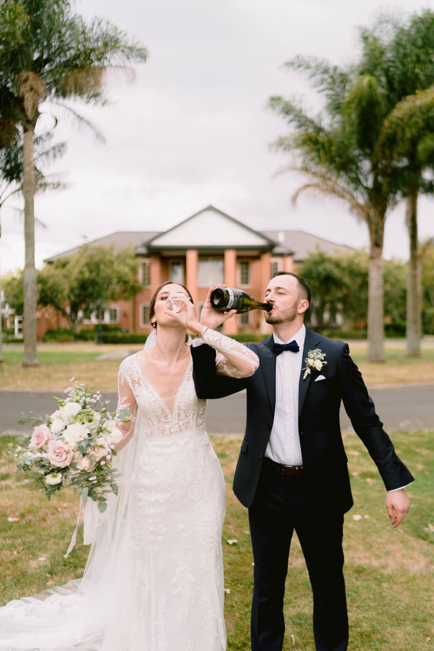 A celebratory moment with champagne outdoors during a wedding celebration.