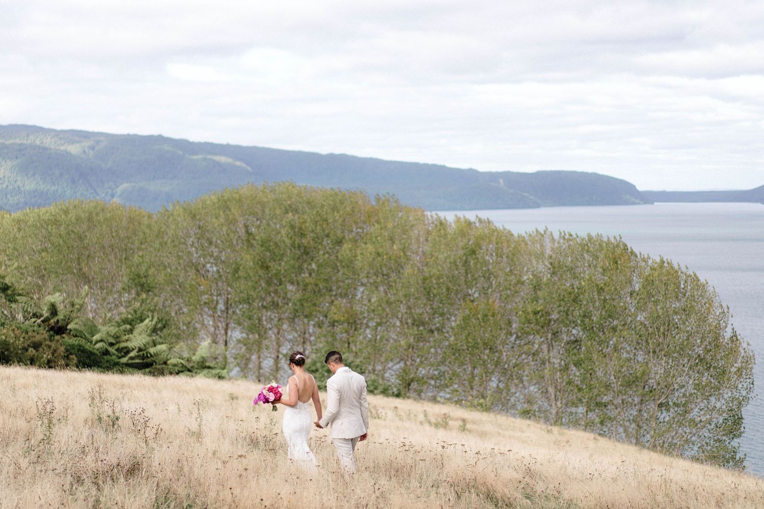 Panoramic mountain landscape with water view at outdoor wedding venue.