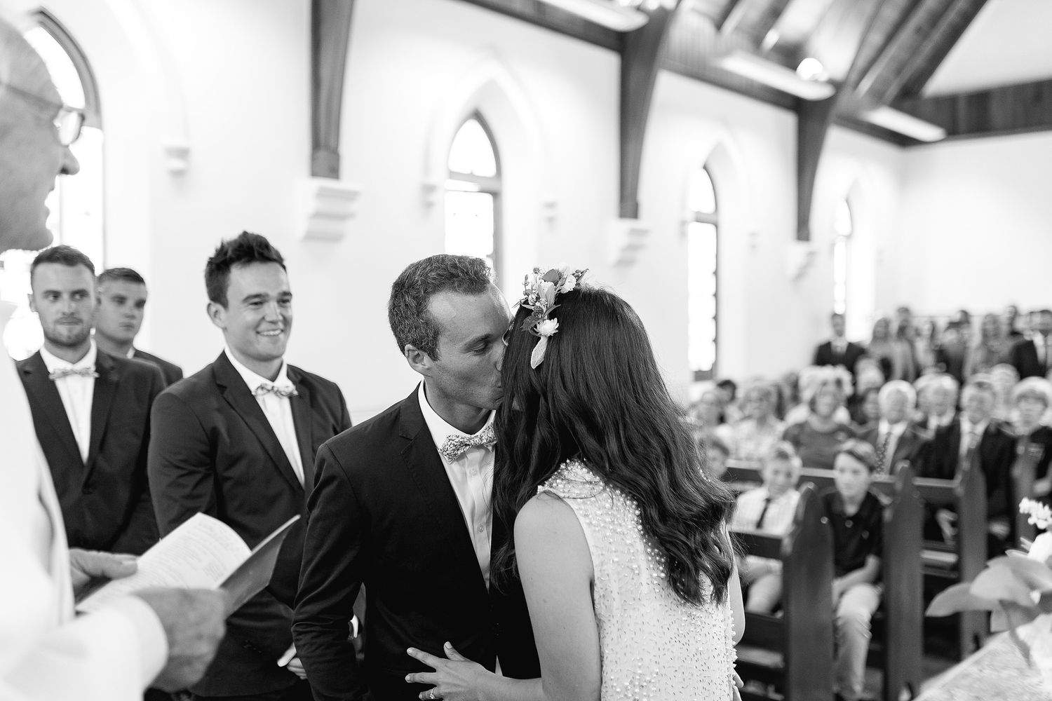 A romantic black and white photo series showing couples dancing at an elegant wedding reception.
