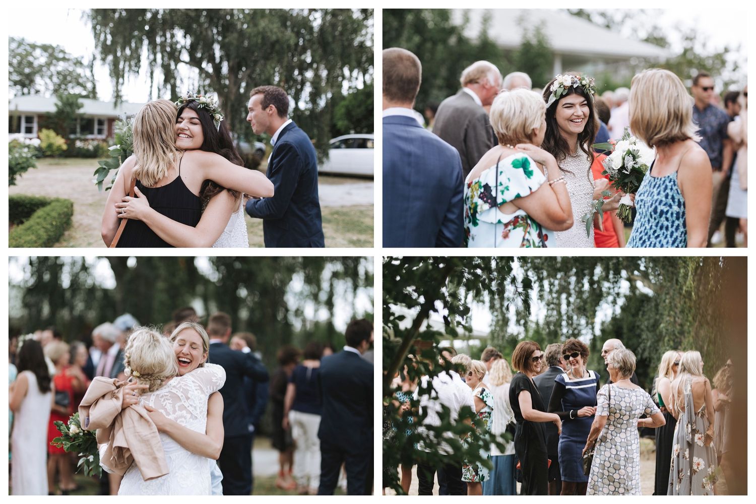Wedding guests share warm embraces and joyful conversations during an outdoor reception surrounded by lush greenery.