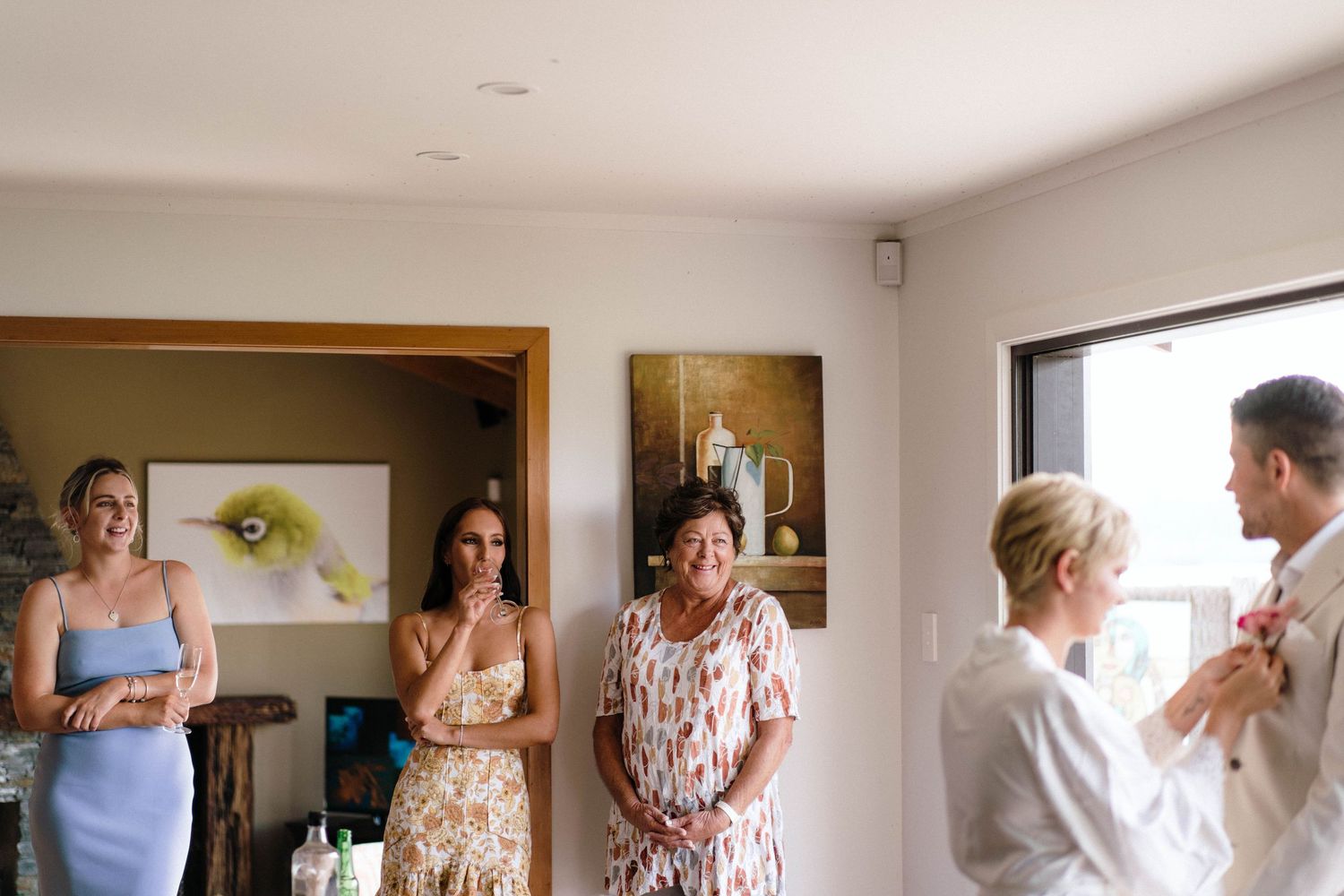 Getting ready room scene with soft natural lighting showing wedding day preparations.