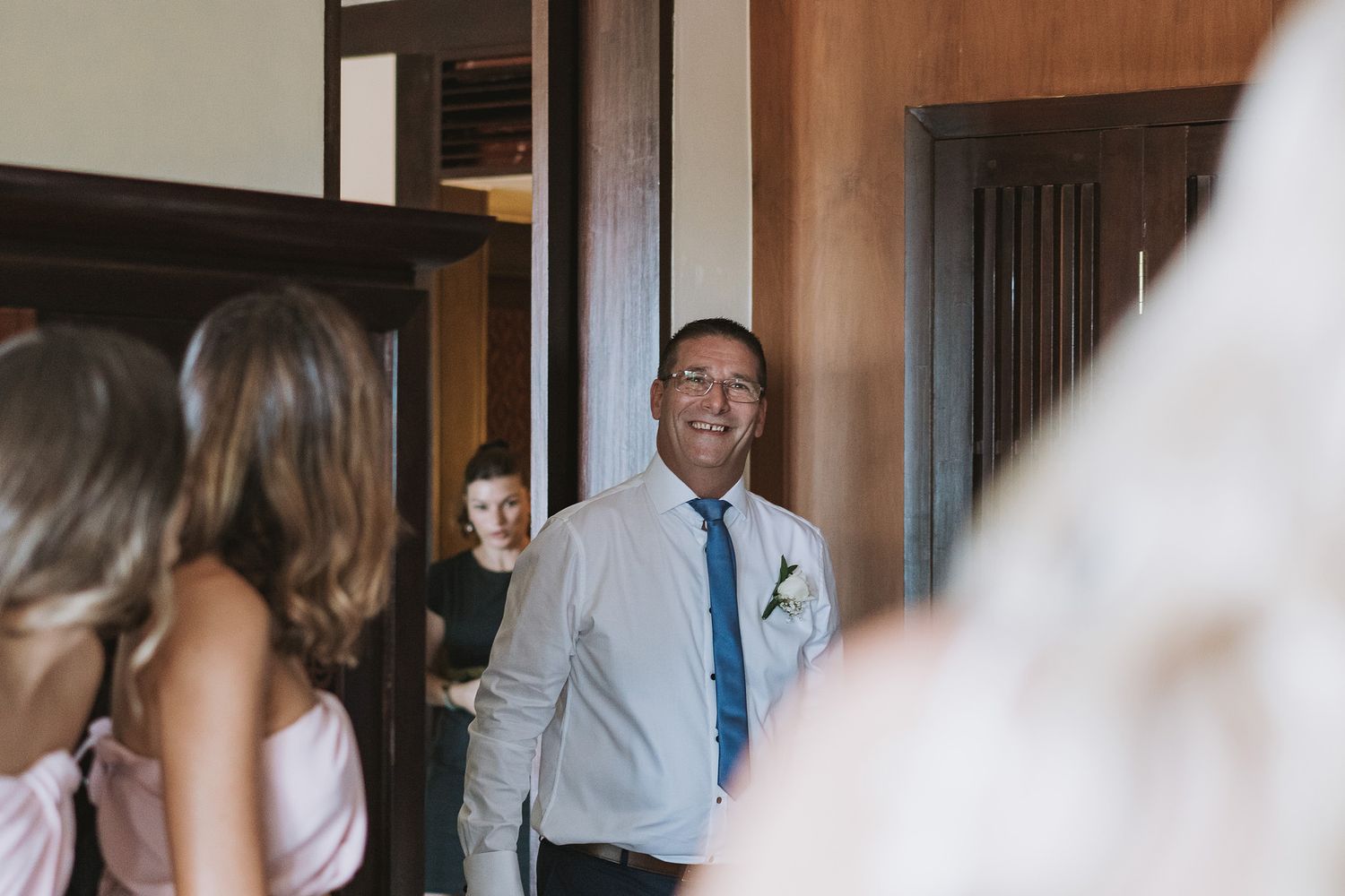 People gather in a hallway during a formal event.