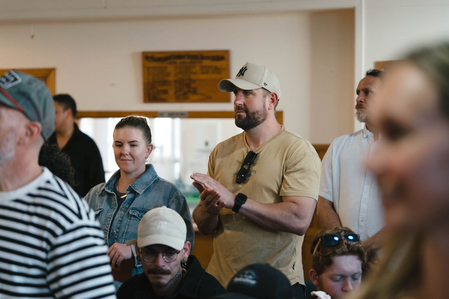 Congregation members participating in worship at a church gathering.