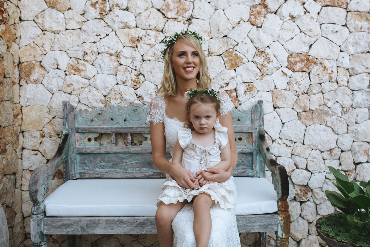 White stone walls and tropical landscaping create an elegant resort backdrop with relaxing seating areas.
