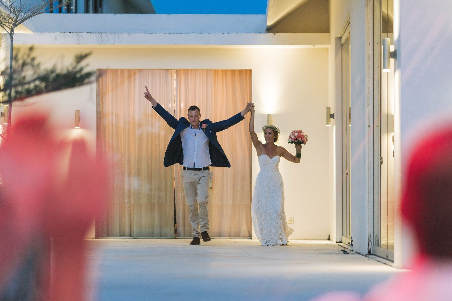 Modern wedding venue interior with minimalist white decor and natural lighting through large windows.