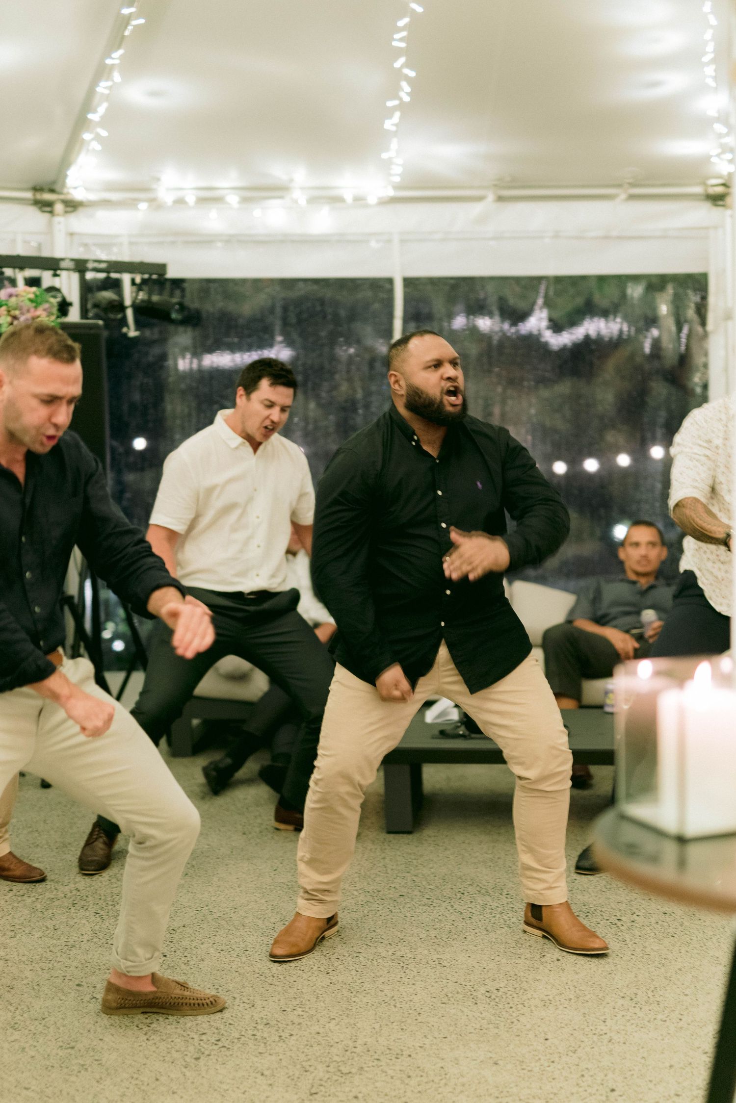 A series of people demonstrating lunging exercises while wearing business casual attire in an office setting.