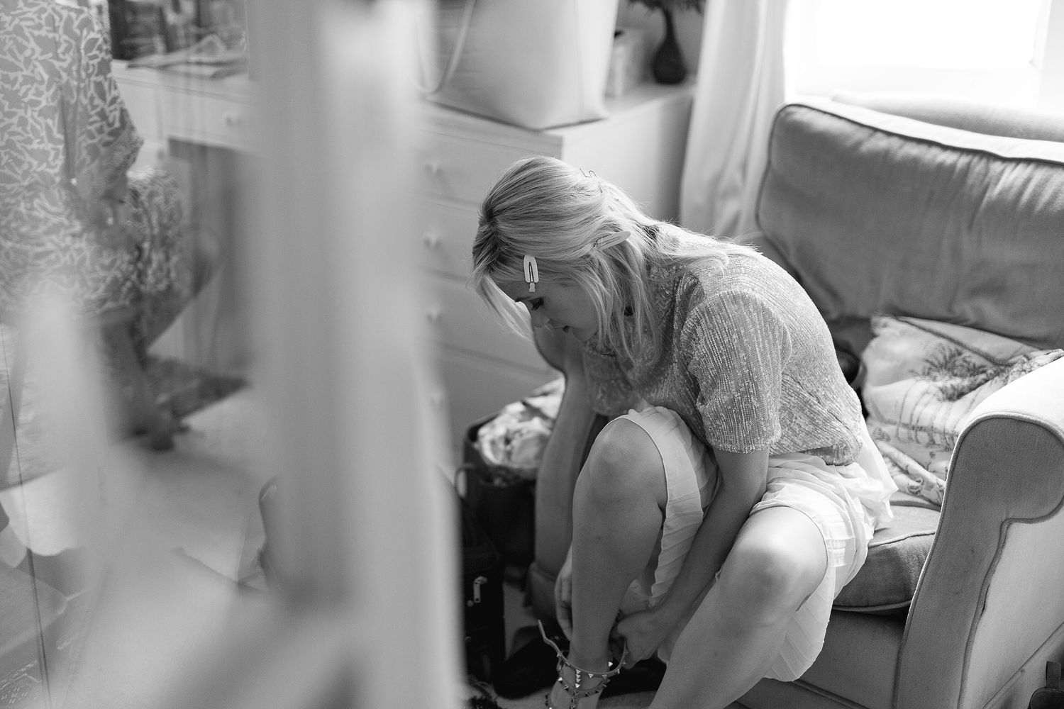A series of monochrome surveillance camera footage stills showing movement in what appears to be an indoor space.