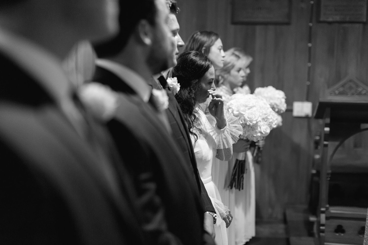A series of black and white wedding photos showing couples at the altar during their ceremony.