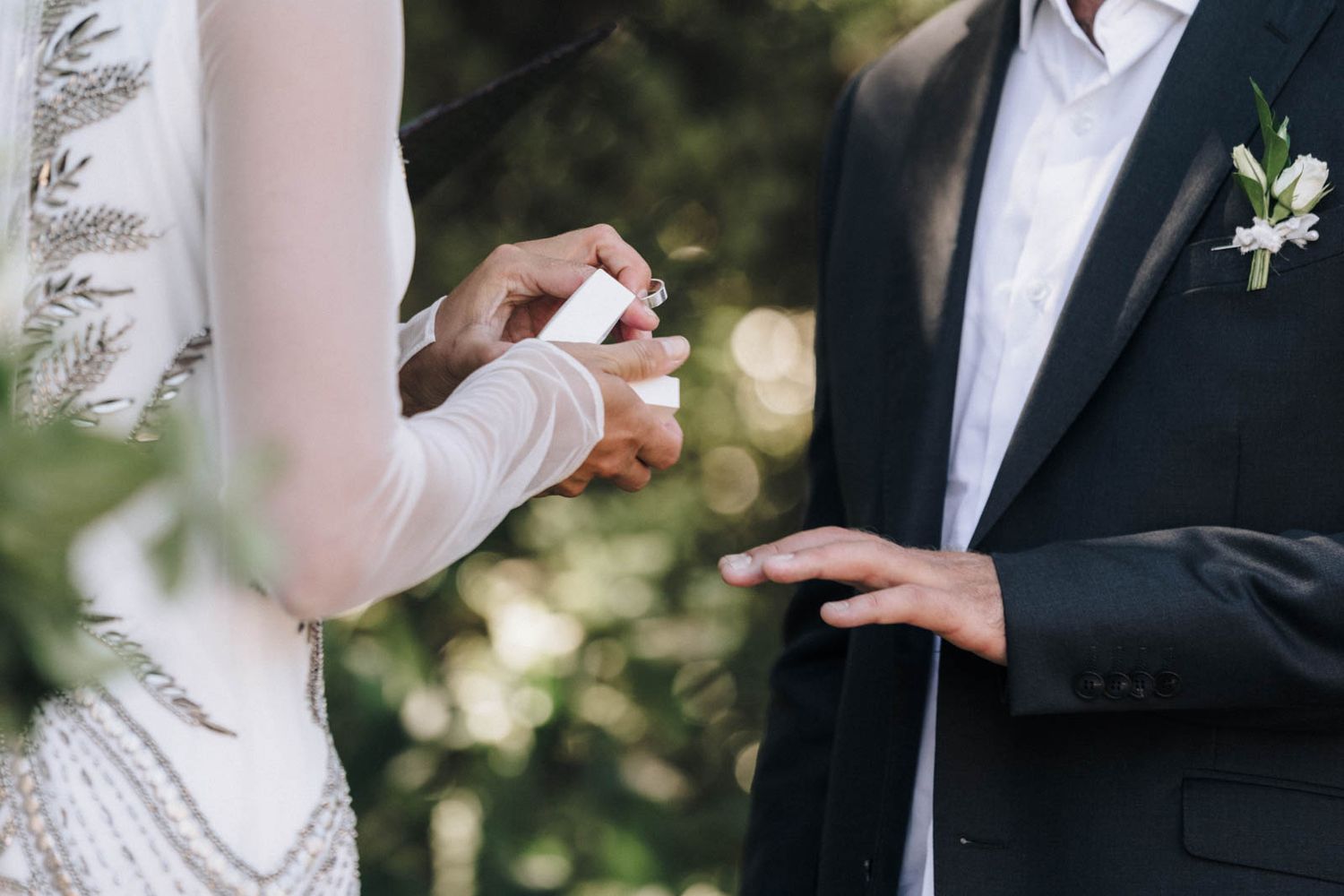 Elegant outdoor wedding with close up shots of bride and groom holding hands and exchanging wedding vows.