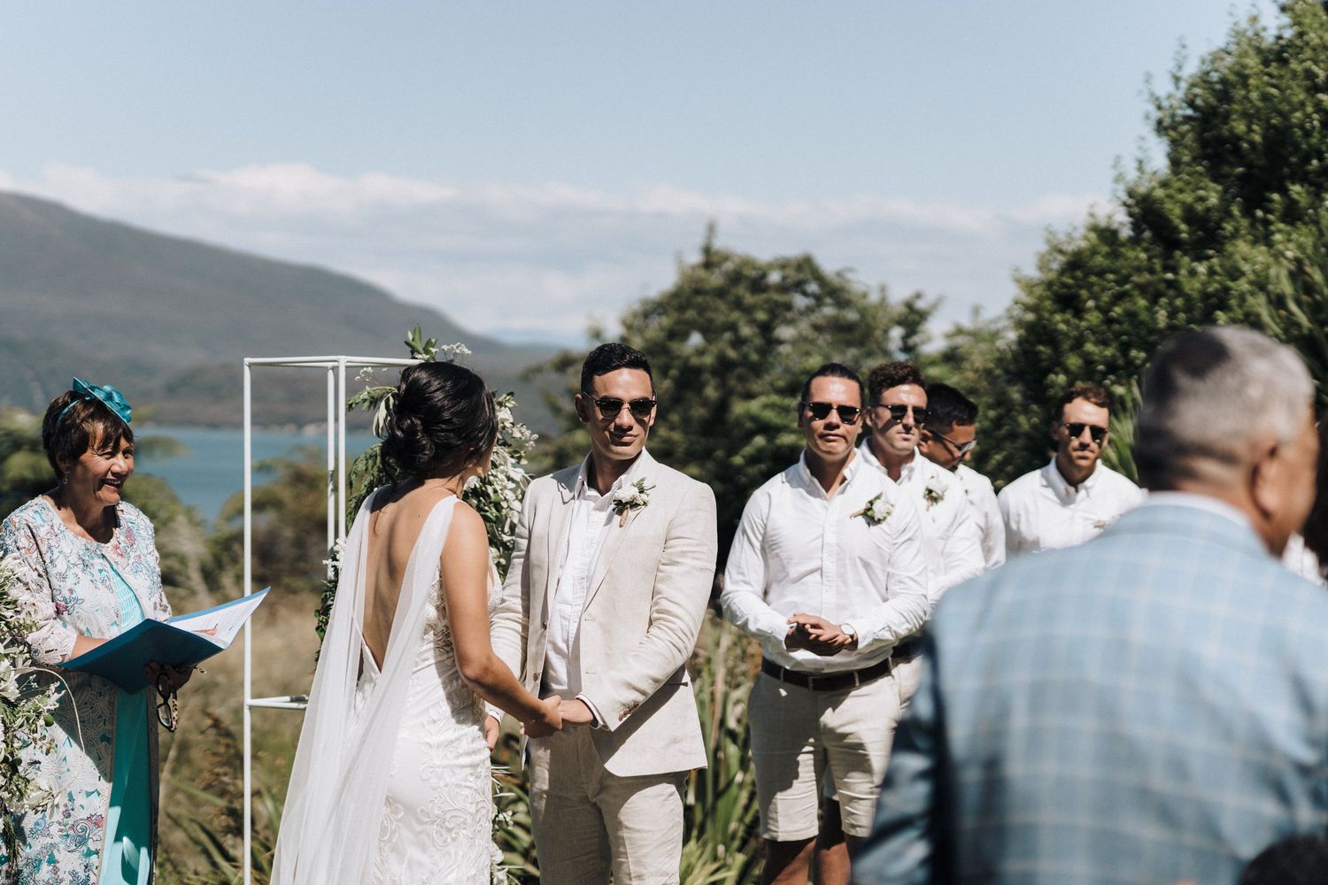 An outdoor mountain wedding ceremony with stunning natural backdrop.