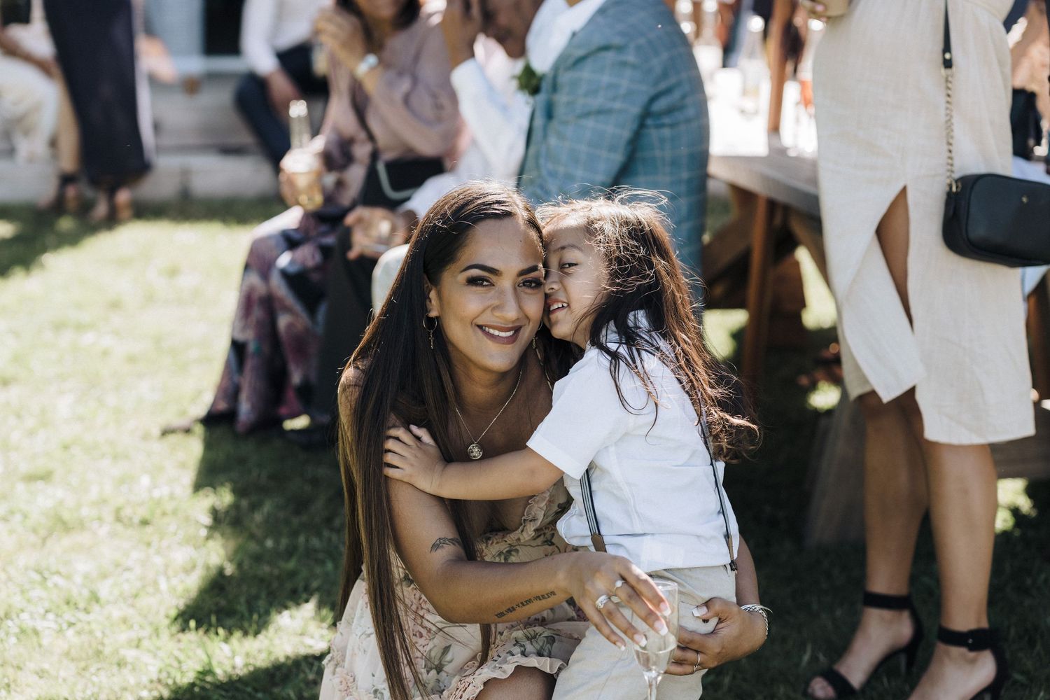 Candid moments of celebration and laughter during an outdoor wedding reception.