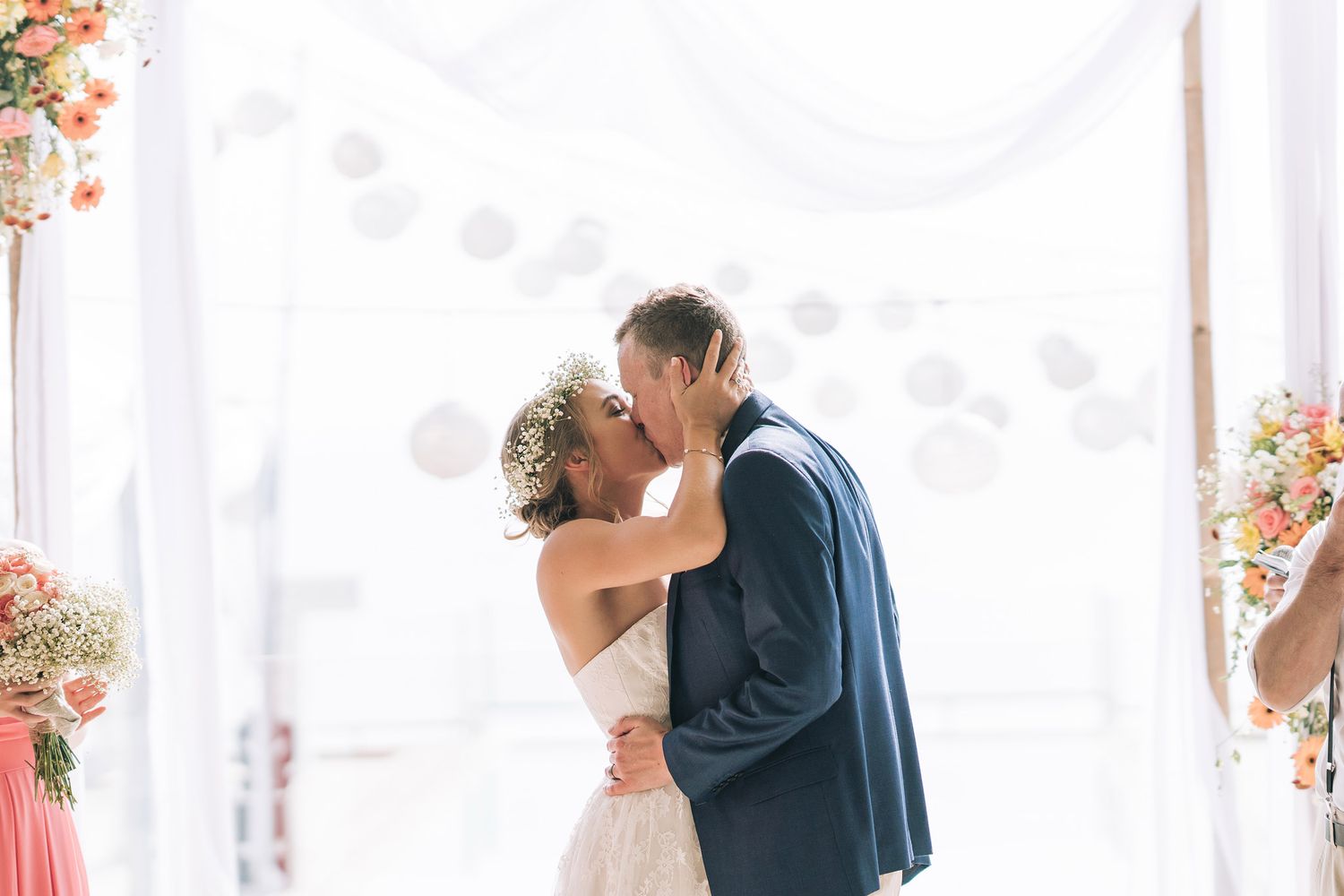 An assortment of intimate wedding moments showing couples embracing during first looks against a soft natural backdrop.