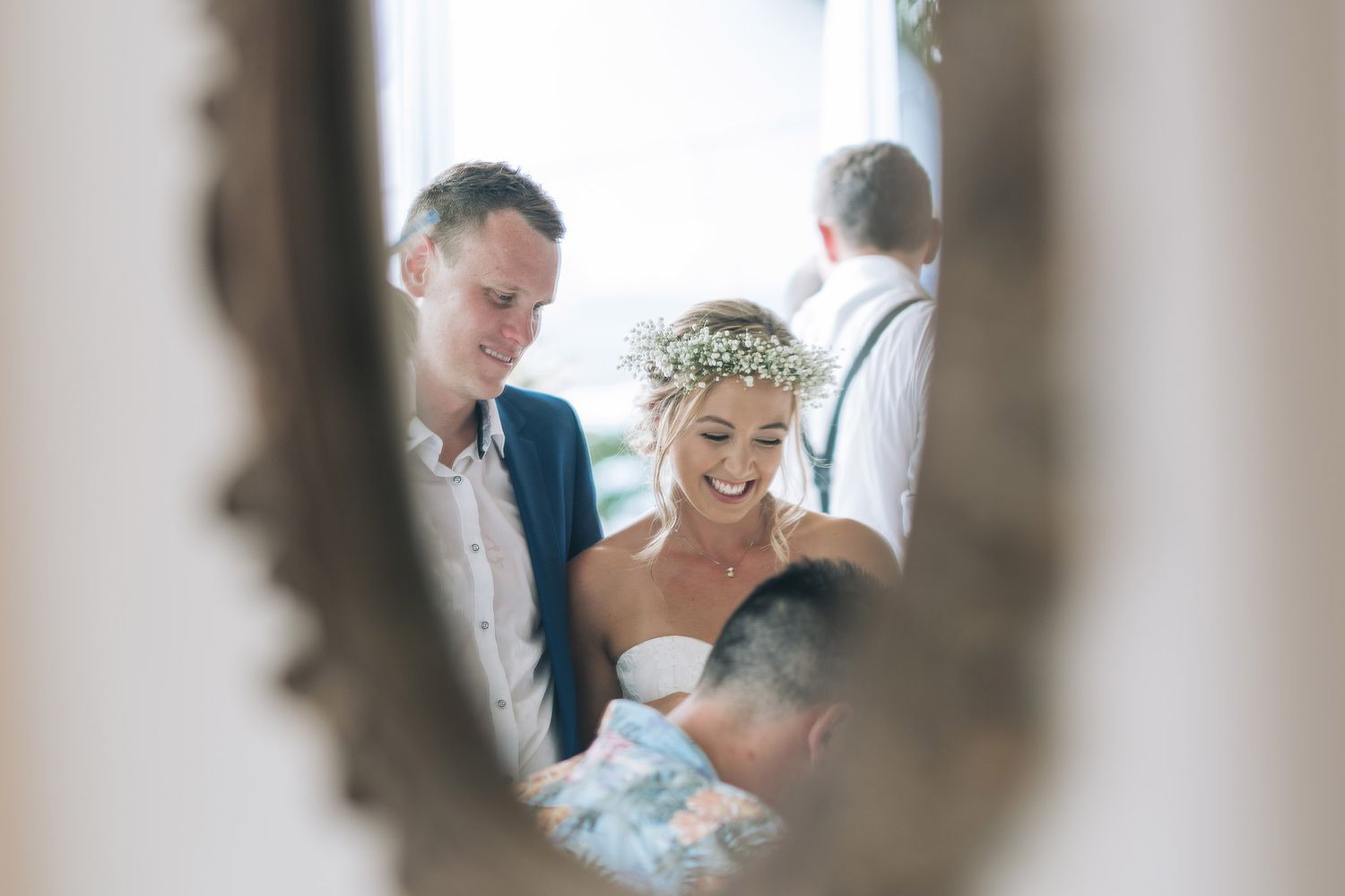 Multiple reflected images show wedding preparation moments captured through elegant vanity mirrors.