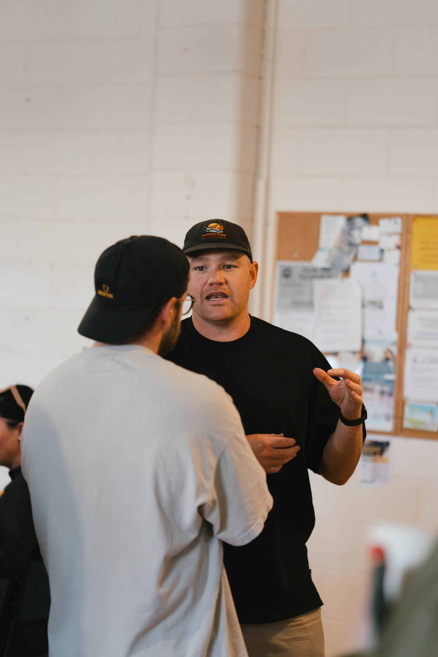 Two people having an animated discussion in a community gathering space.