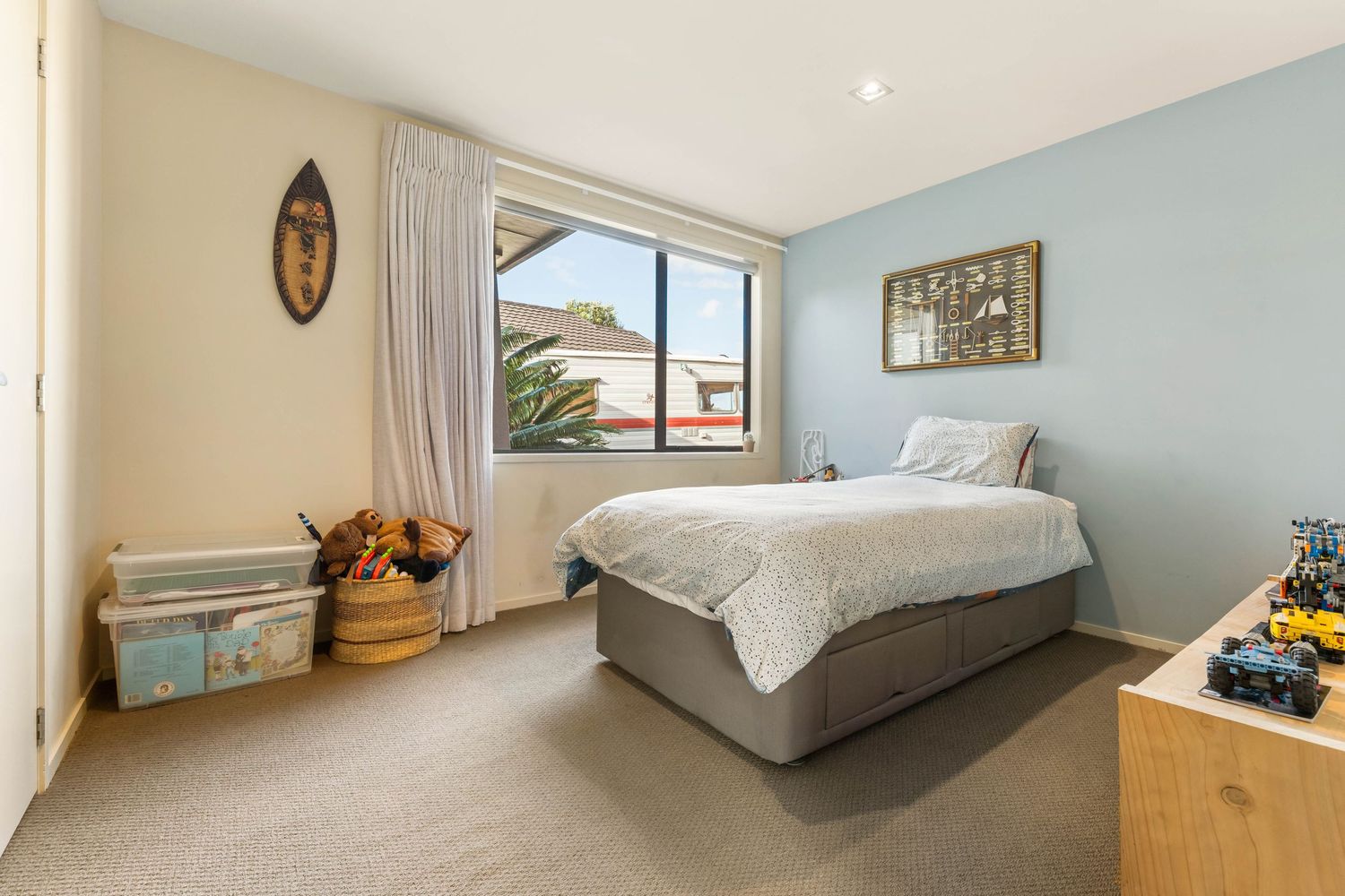 A panoramic view of six small bedrooms with light-colored walls, basic furnishings, and natural lighting.