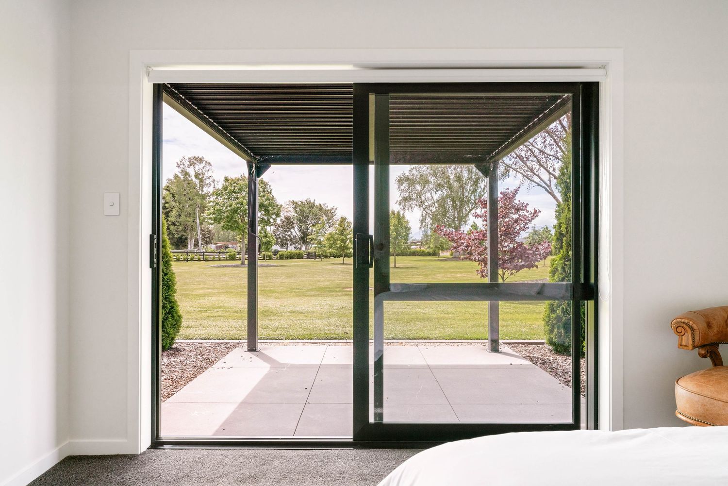 Modern interior room with large horizontal windows offering panoramic views of the surrounding landscape.