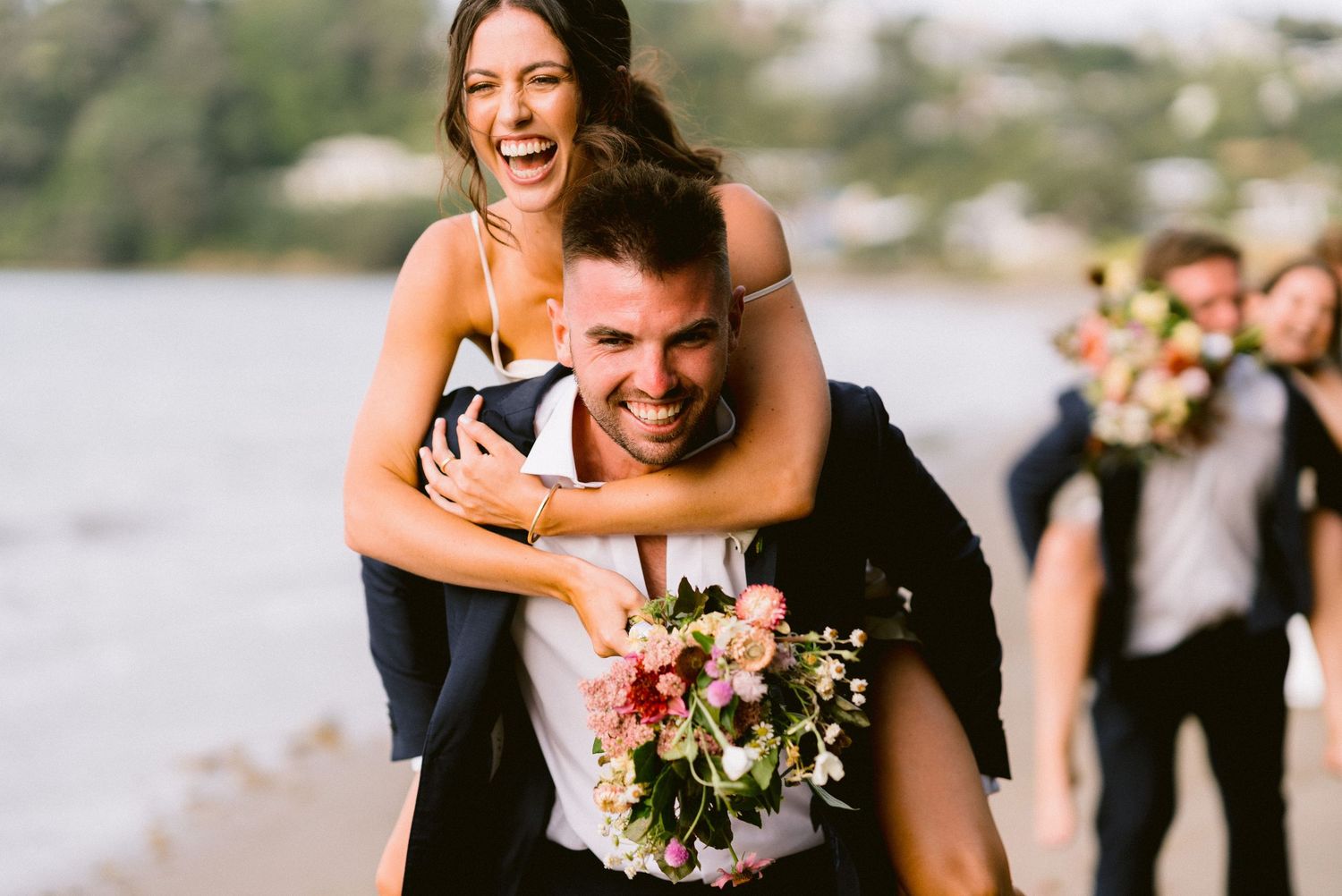 Joyful candid moments captured during a sunny outdoor wedding celebration.
