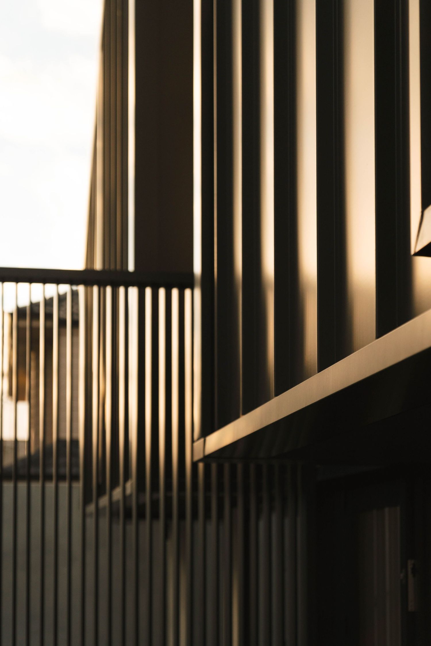 Abstract pattern of vertical black and white stripes creating dramatic shadows and contrast.