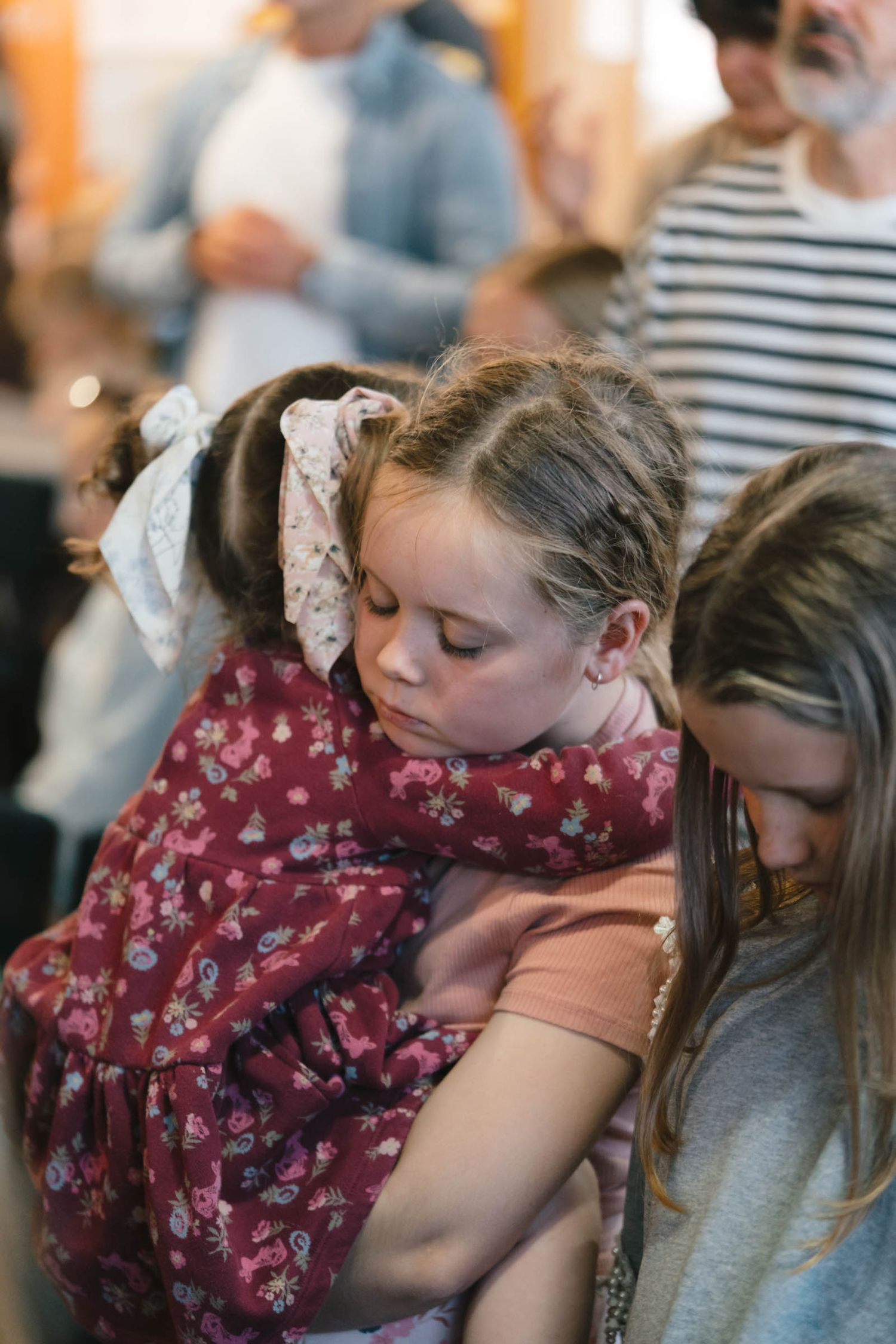 Young attendees during a church service in casual attire.