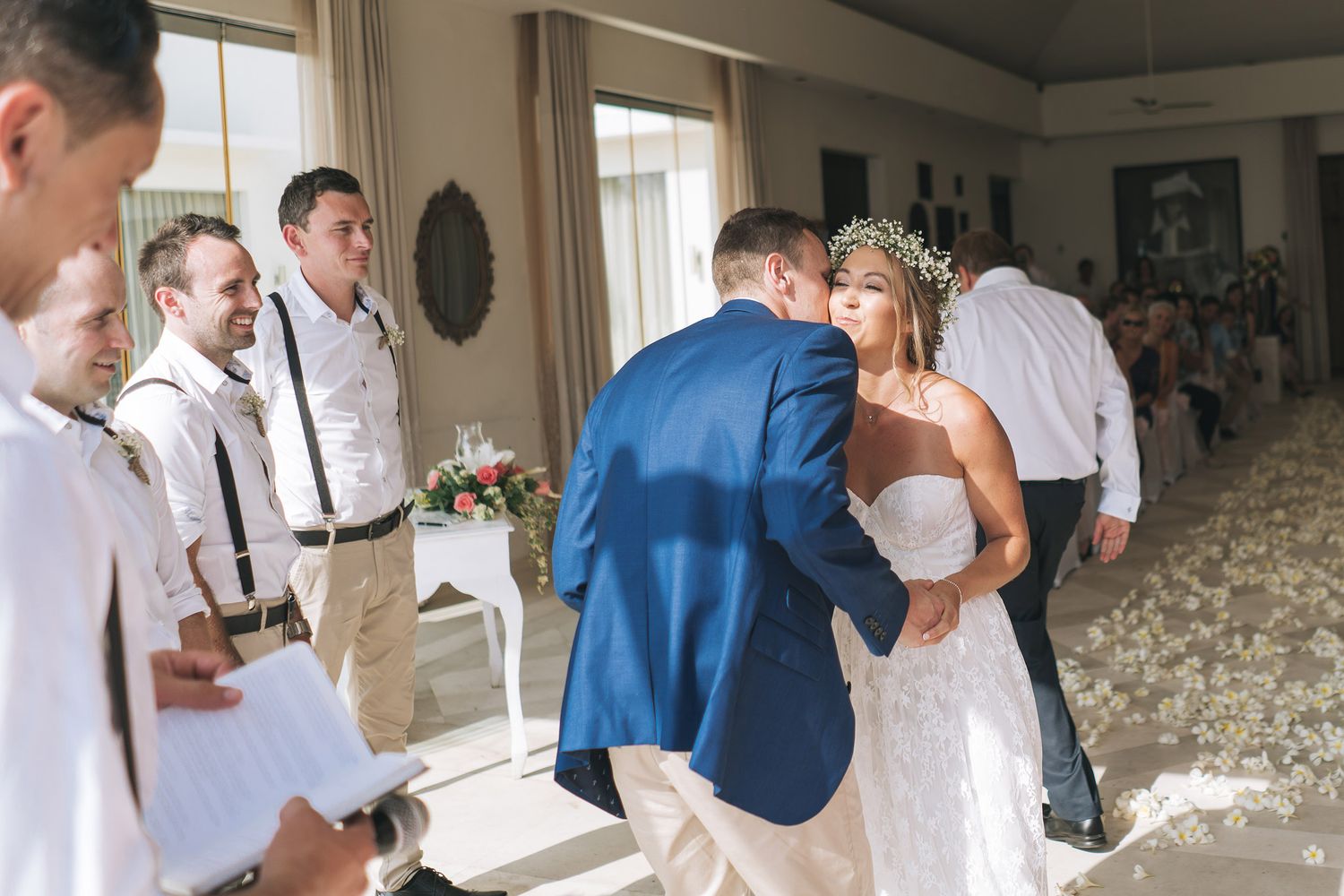 Collage of candid indoor moments at an elegant wedding celebration showing joyful interactions and dancing.